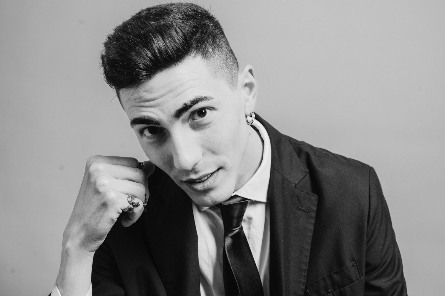 Black and white portrait series showing different poses in formal attire.