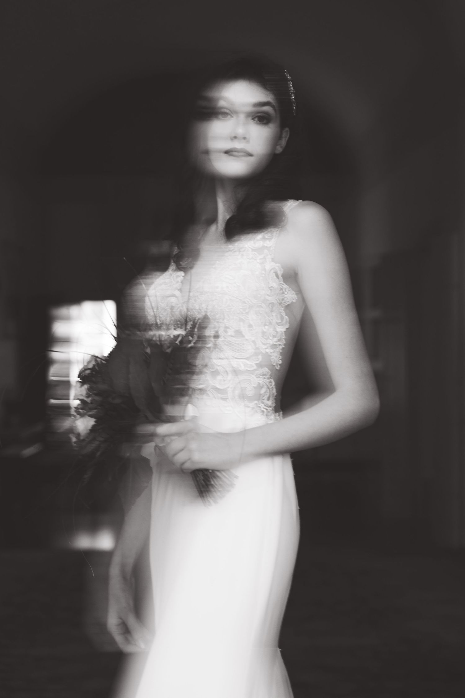 A refined and artistic studio bridal portrait featuring muted dried flowers and delicate accessories. Modern and timeless styling.