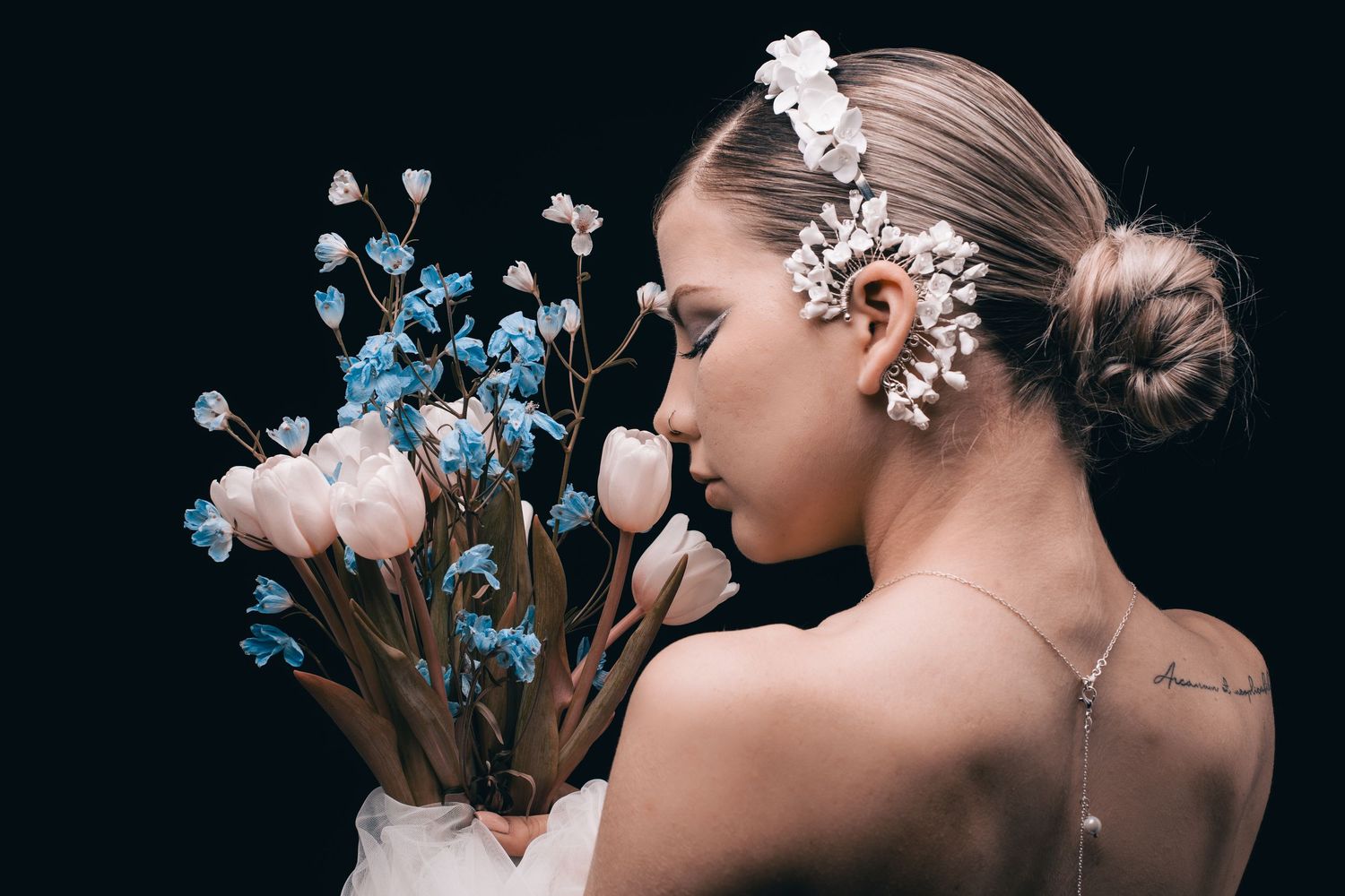 Elegant bridal portrait series with blue and white floral elements.