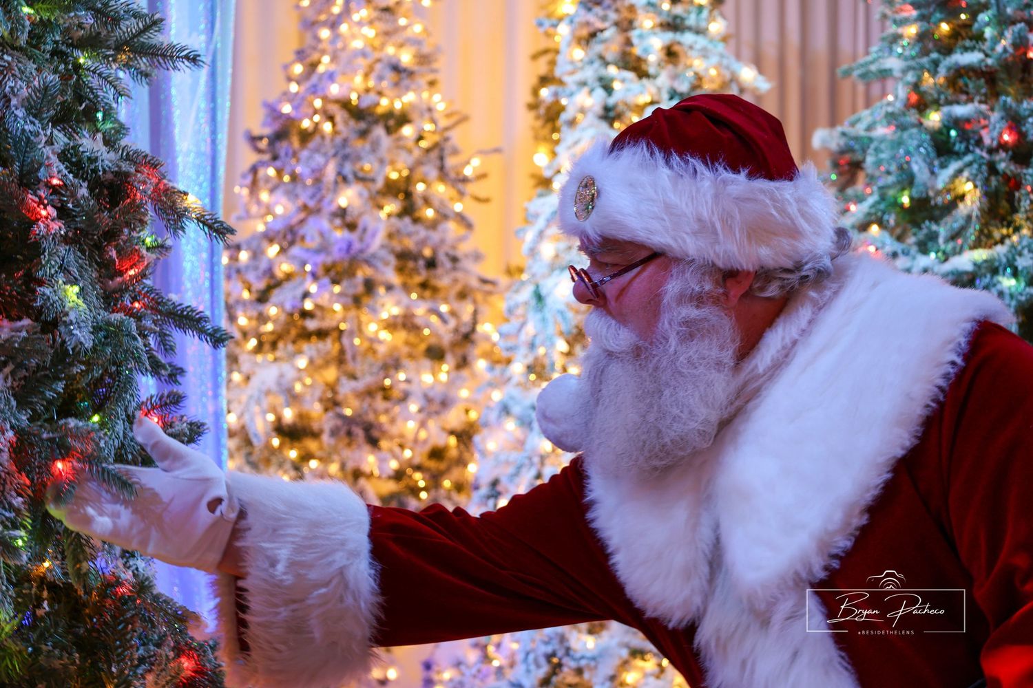 A magical holiday scene with a festive figure in red and white by illuminated Christmas trees.