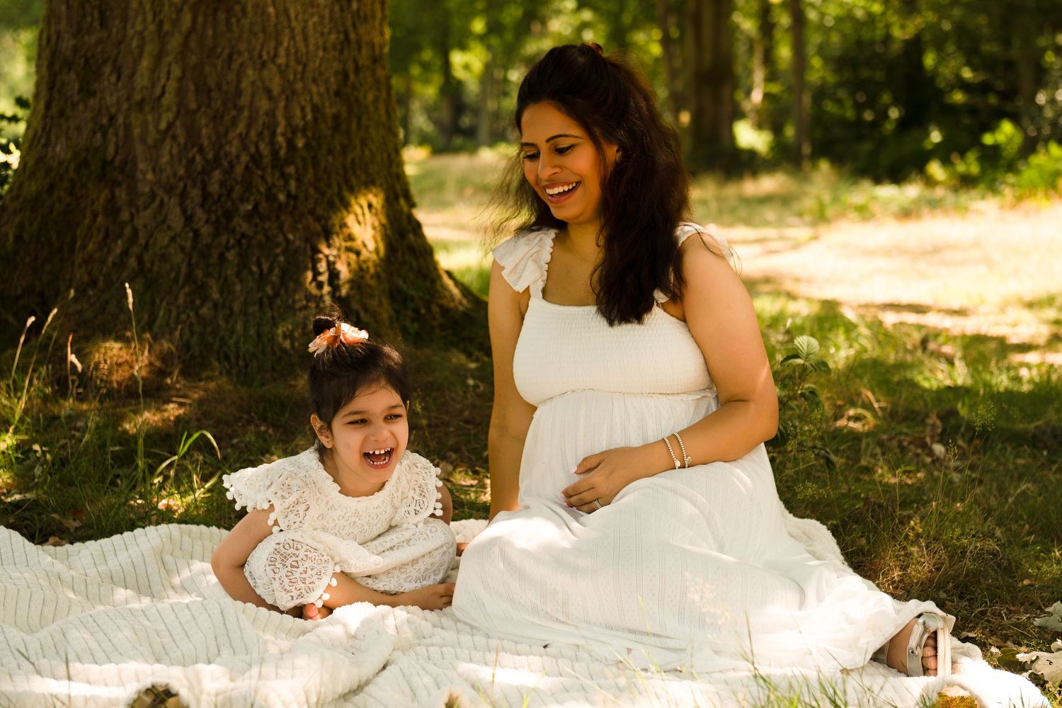 pregnant mother standing in wildflower field near Stanmore – emotive maternity photography