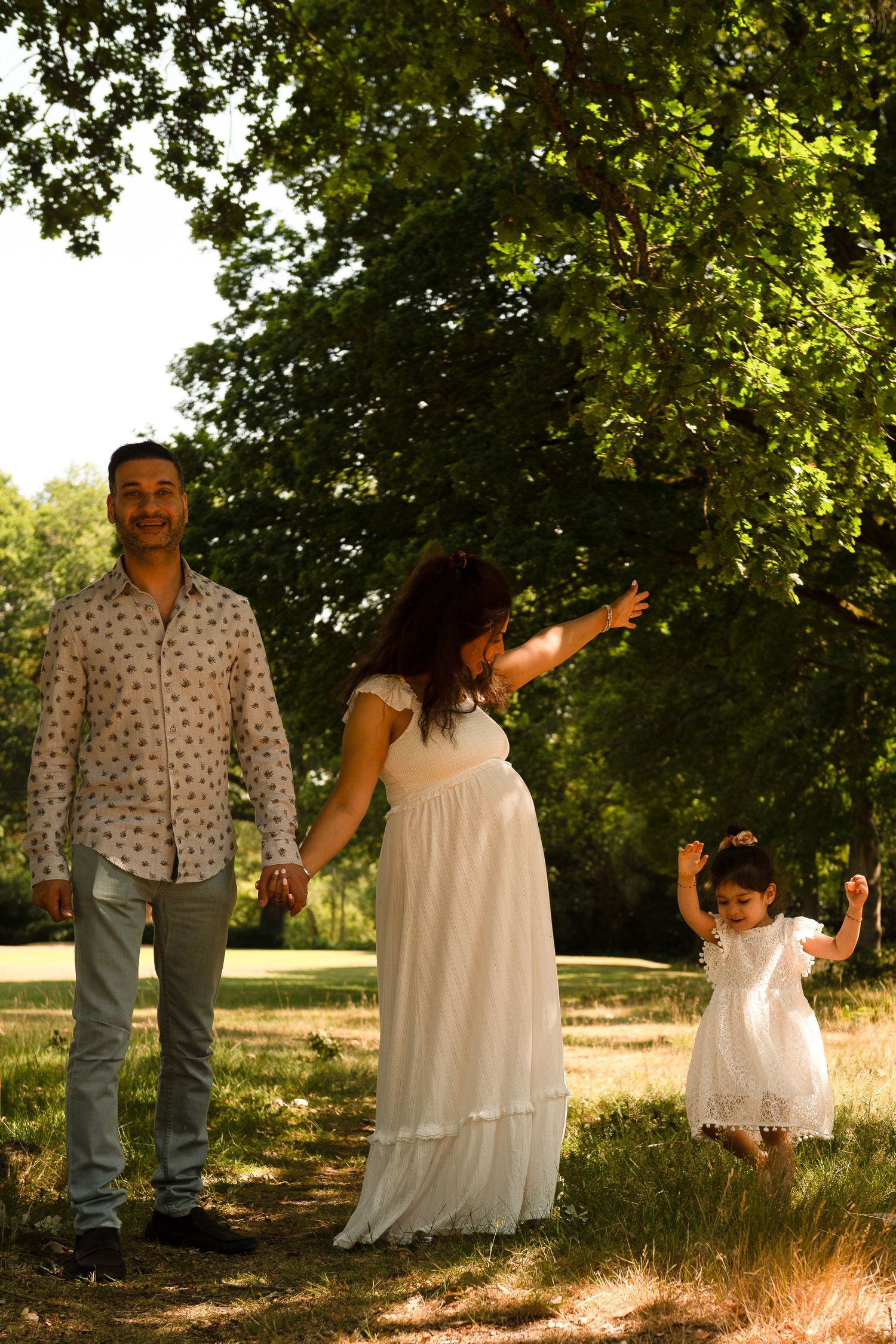 pregnant mother standing in wildflower field near Stanmore – emotive maternity photography