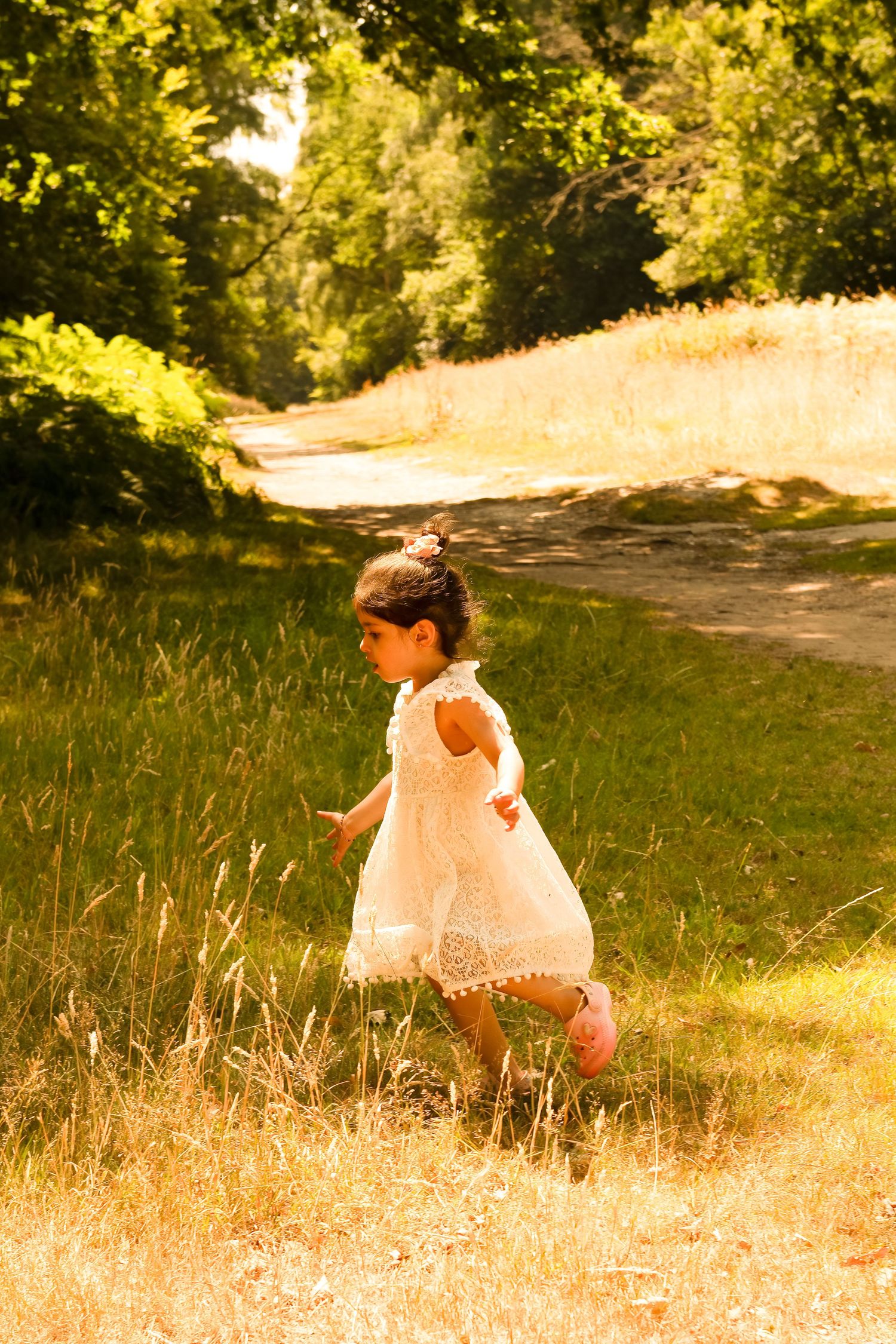 pregnant mother standing in wildflower field near Stanmore – emotive maternity photography