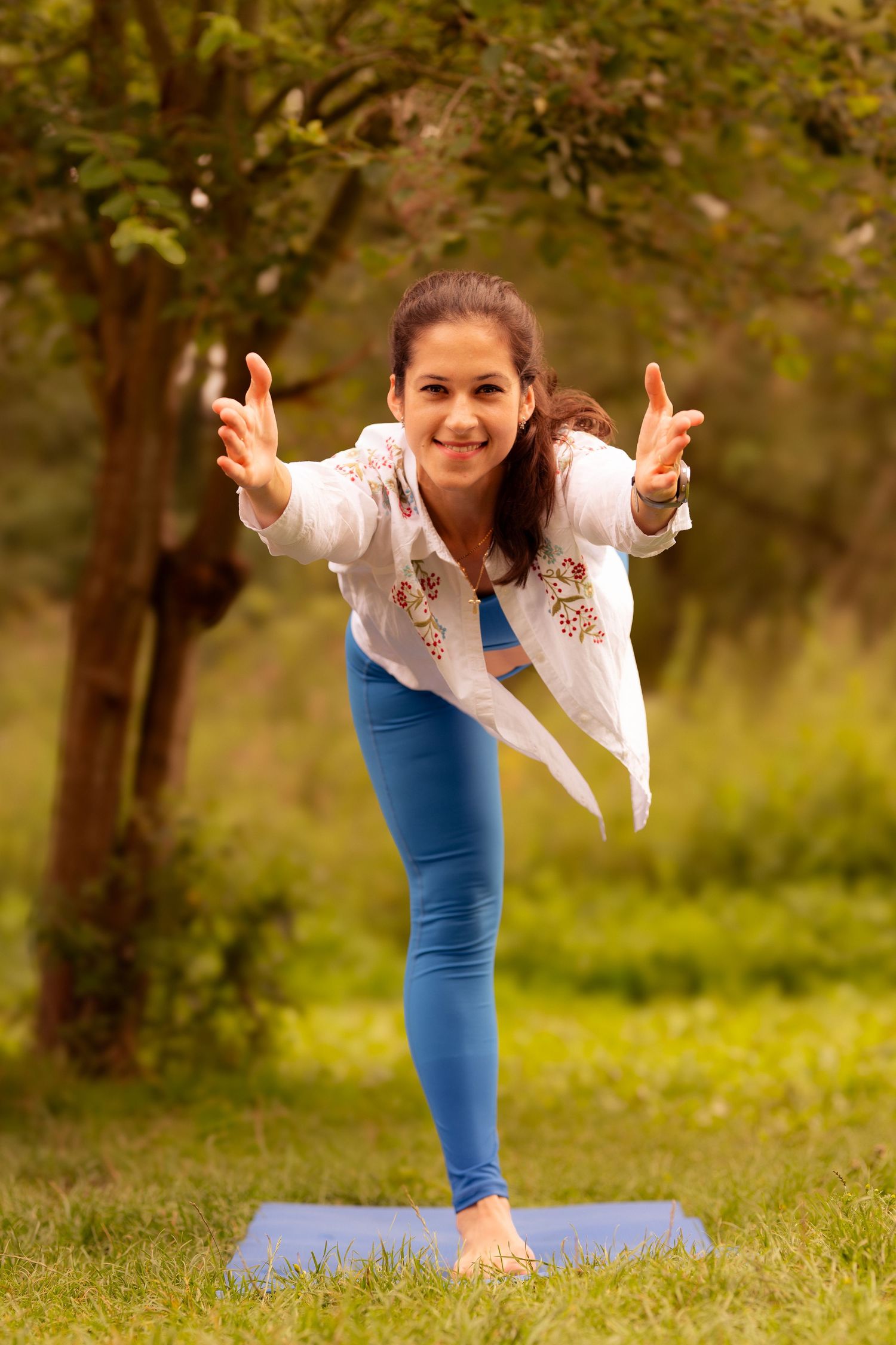 children laughing and running in Moor Park woodland during a family session with natural, emotive style