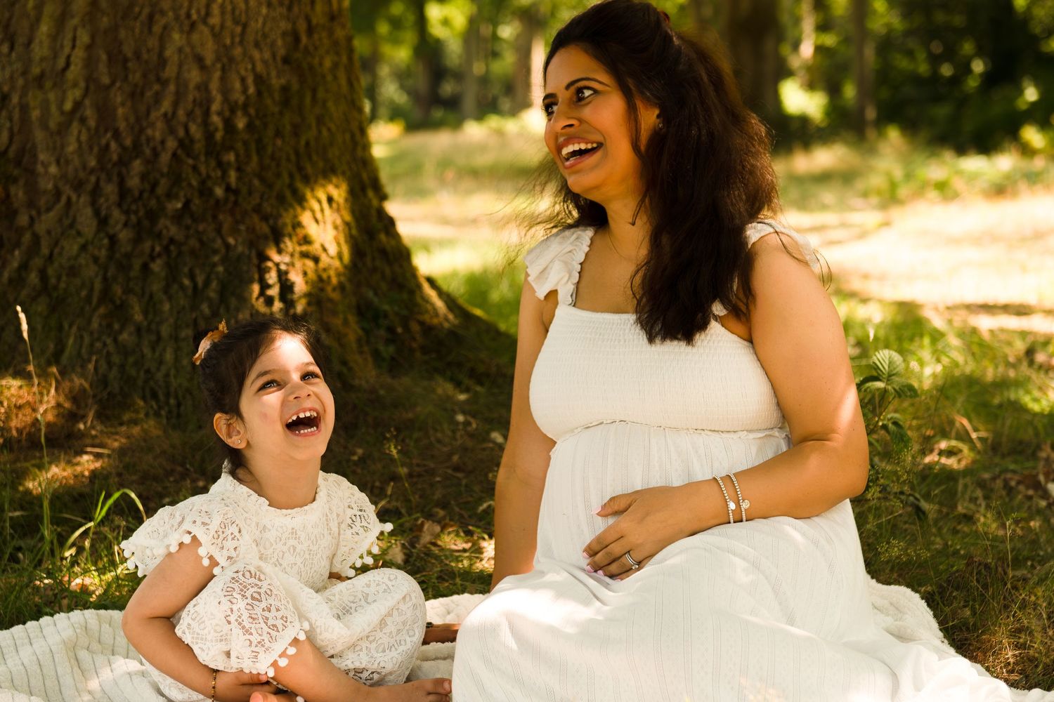 pregnant mother standing in wildflower field near Stanmore – emotive maternity photography
