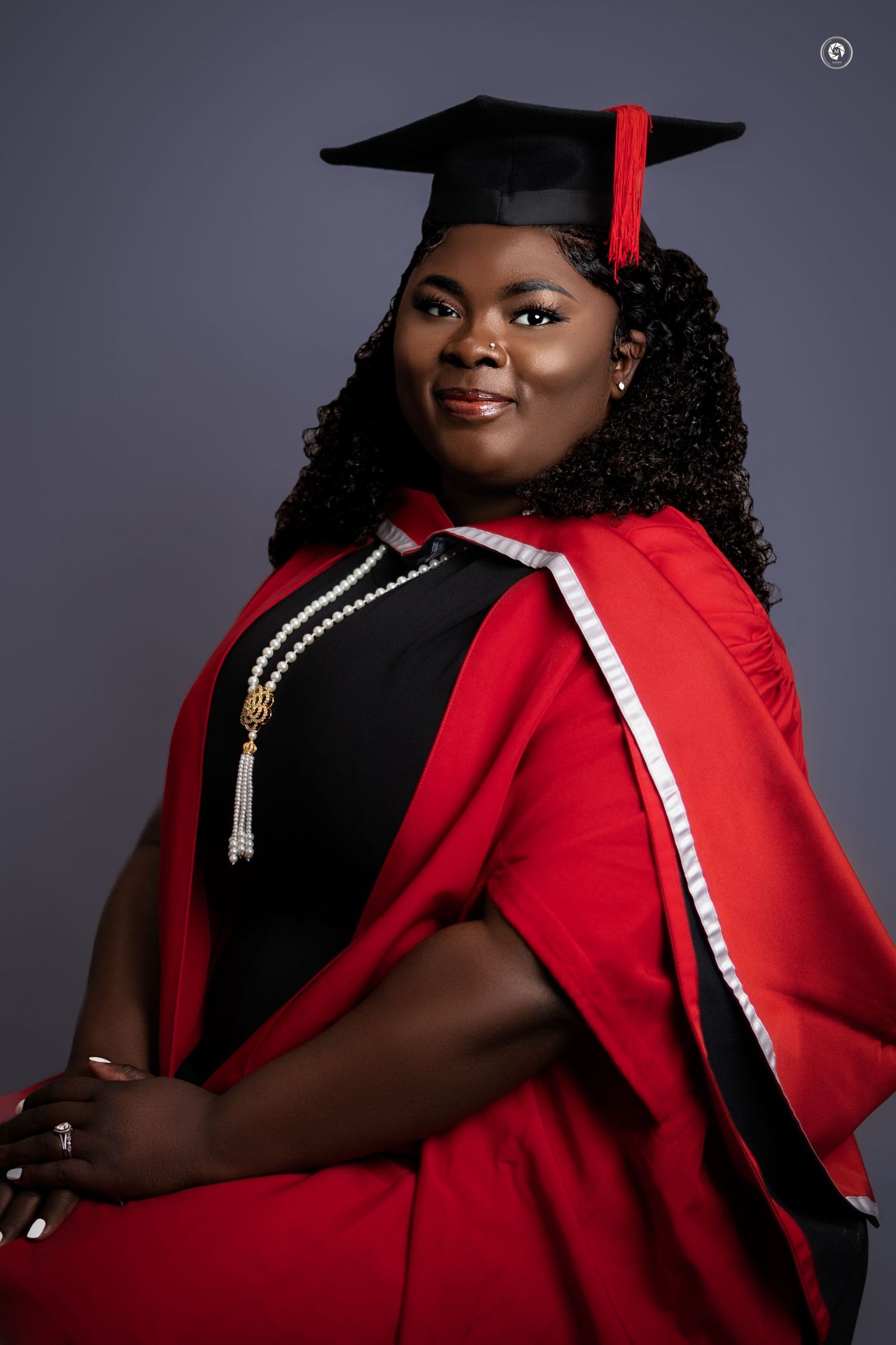 A graduation photo series showing someone in black and red academic regalia against a dark gray background.