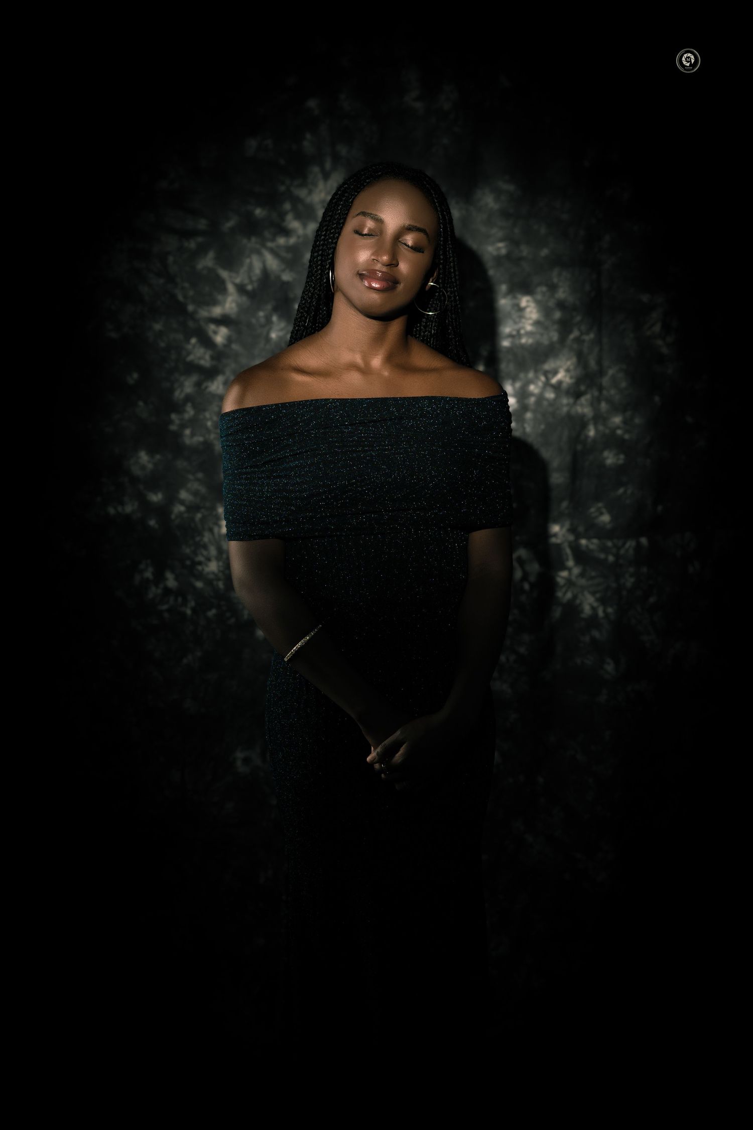 Portrait series of a person wearing a black off-shoulder top against a dark textured background.