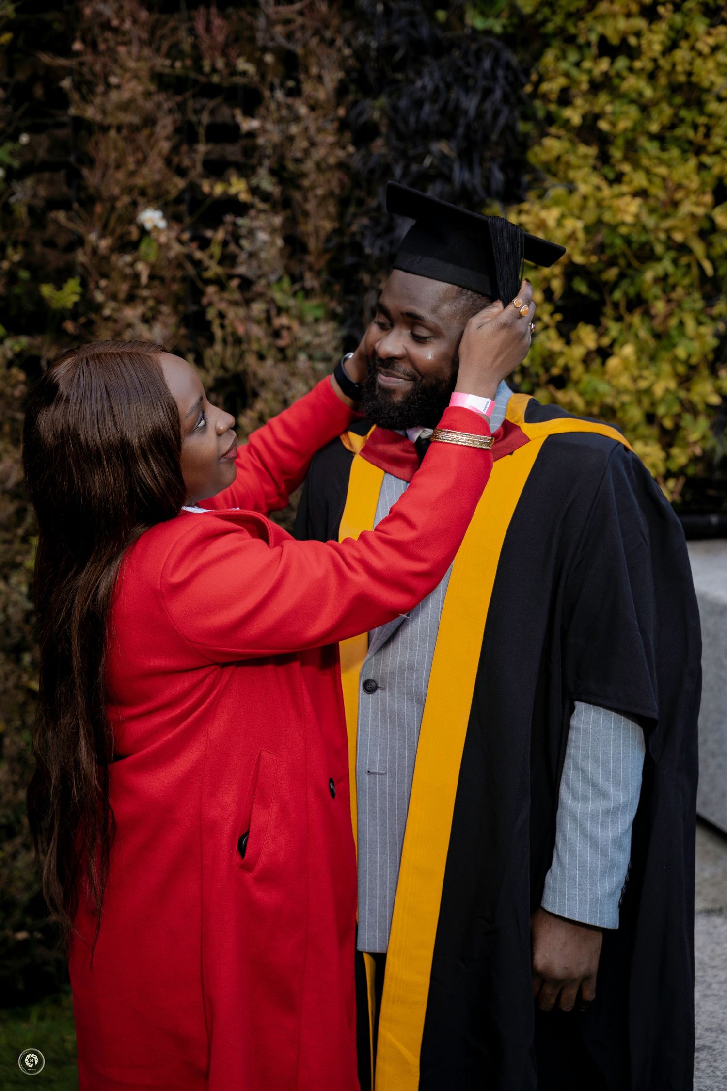 A sequence of five photos shows a person in red adjusting the graduation stole and hood on another person's academic regalia.