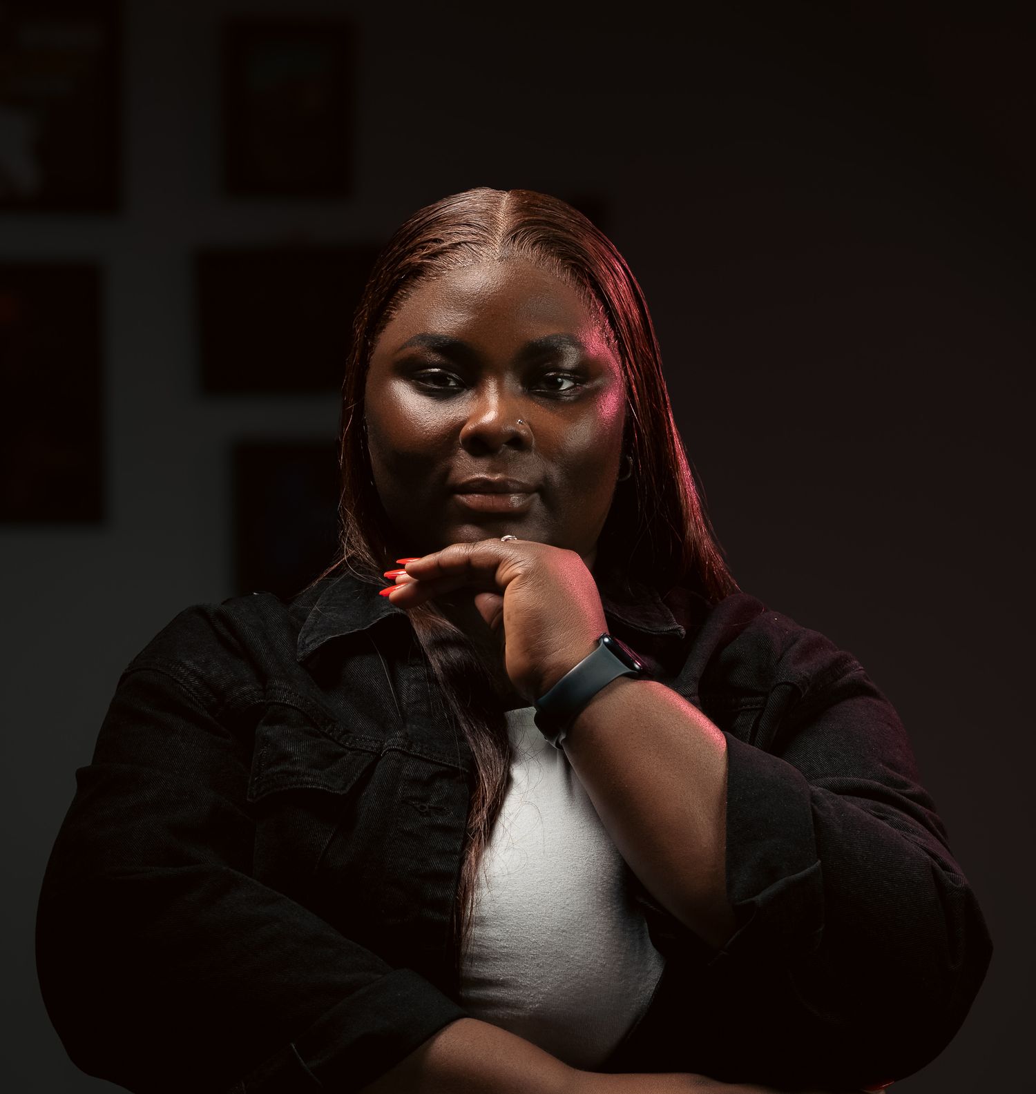 A series of images showing someone gesturing and making expressions in dark dramatic lighting against a black background.