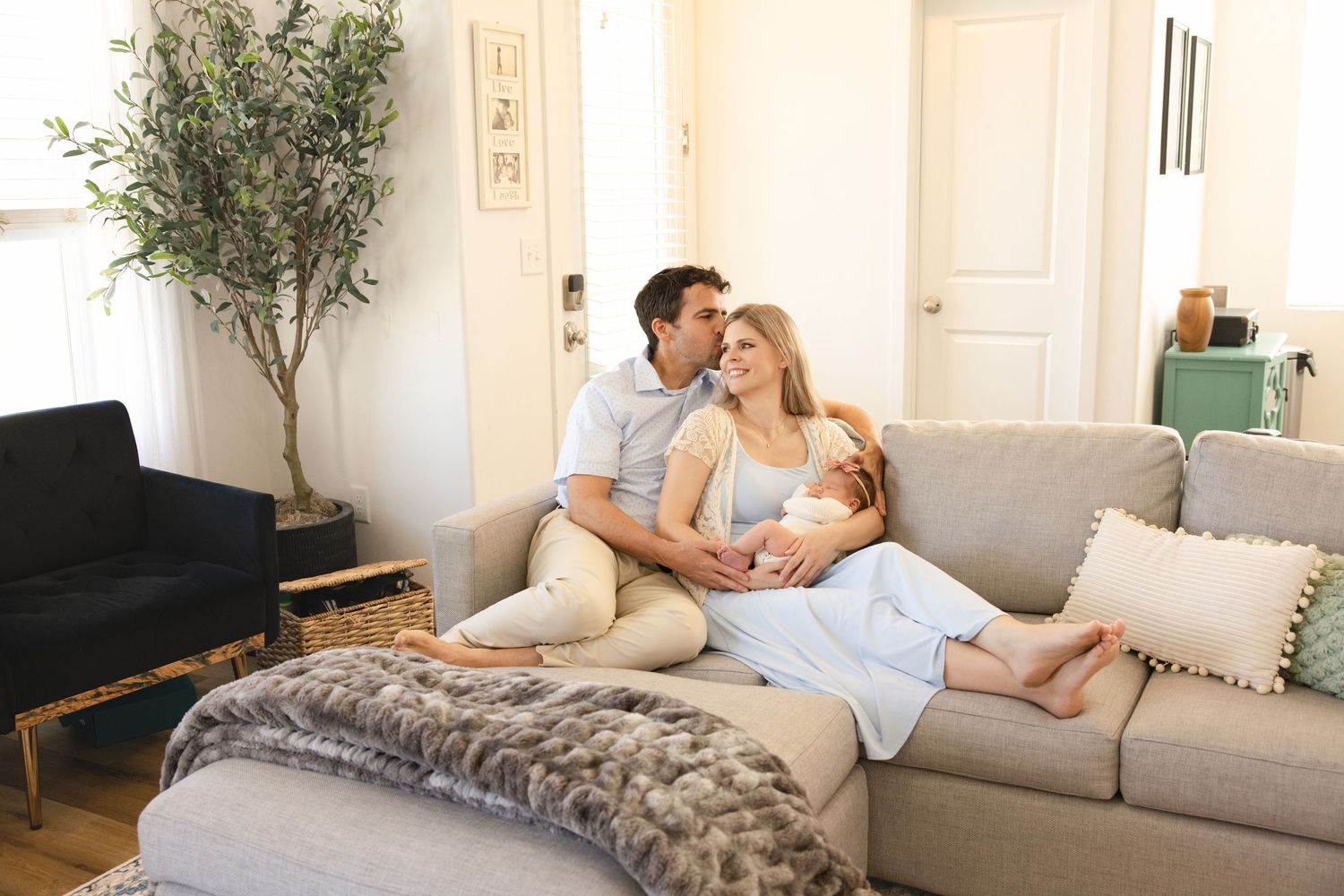 Newborn portraits with family in cozy Utah home