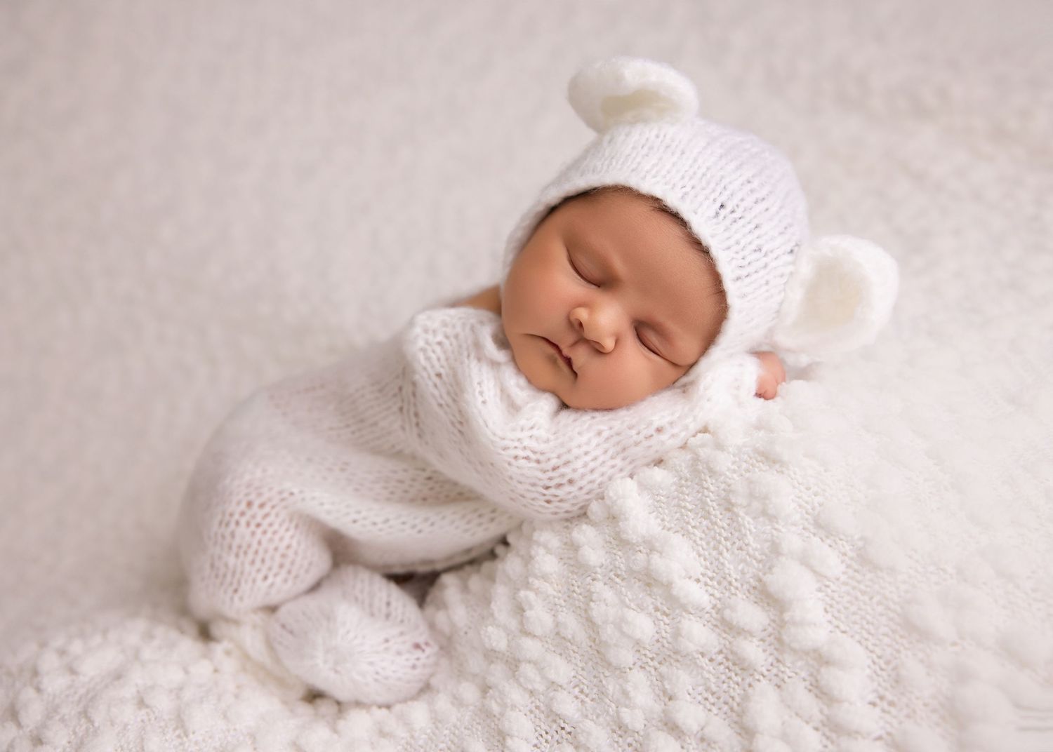 Peaceful newborn portrait with natural light in Layton photography studio
