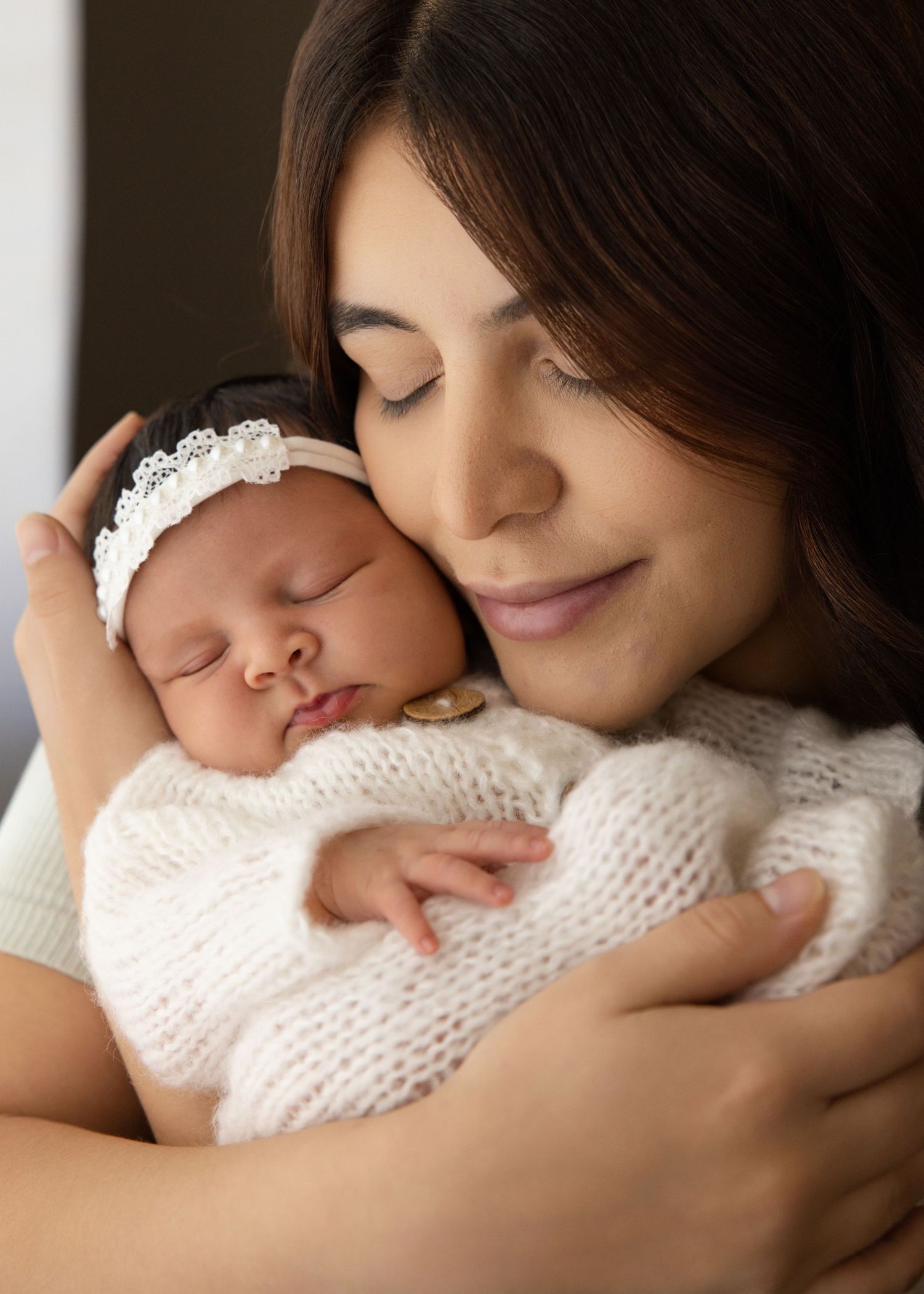 Natural newborn photography with parents in bright Utah home nursery