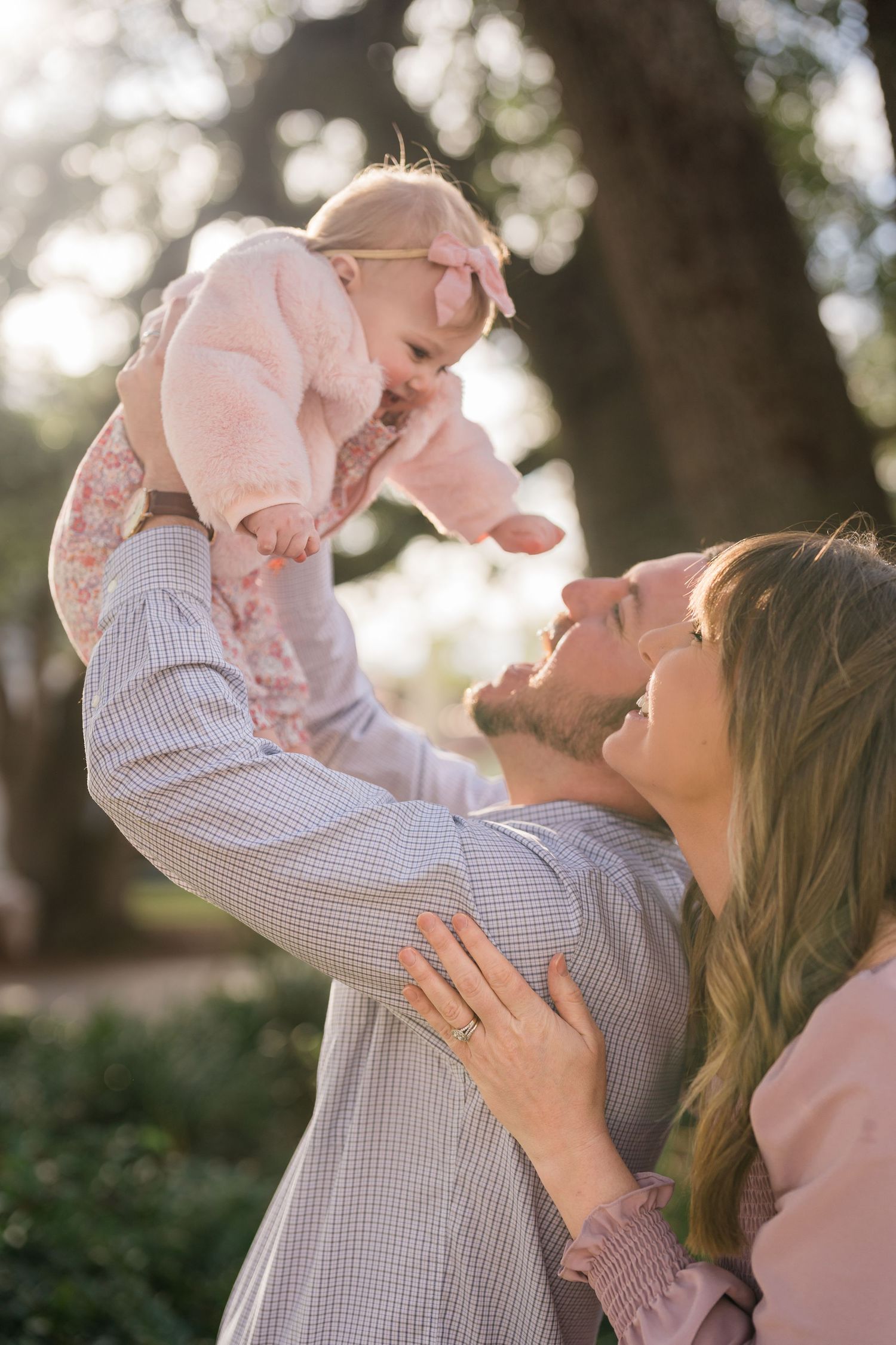 Family embracing during a golden hour session in Central Florida