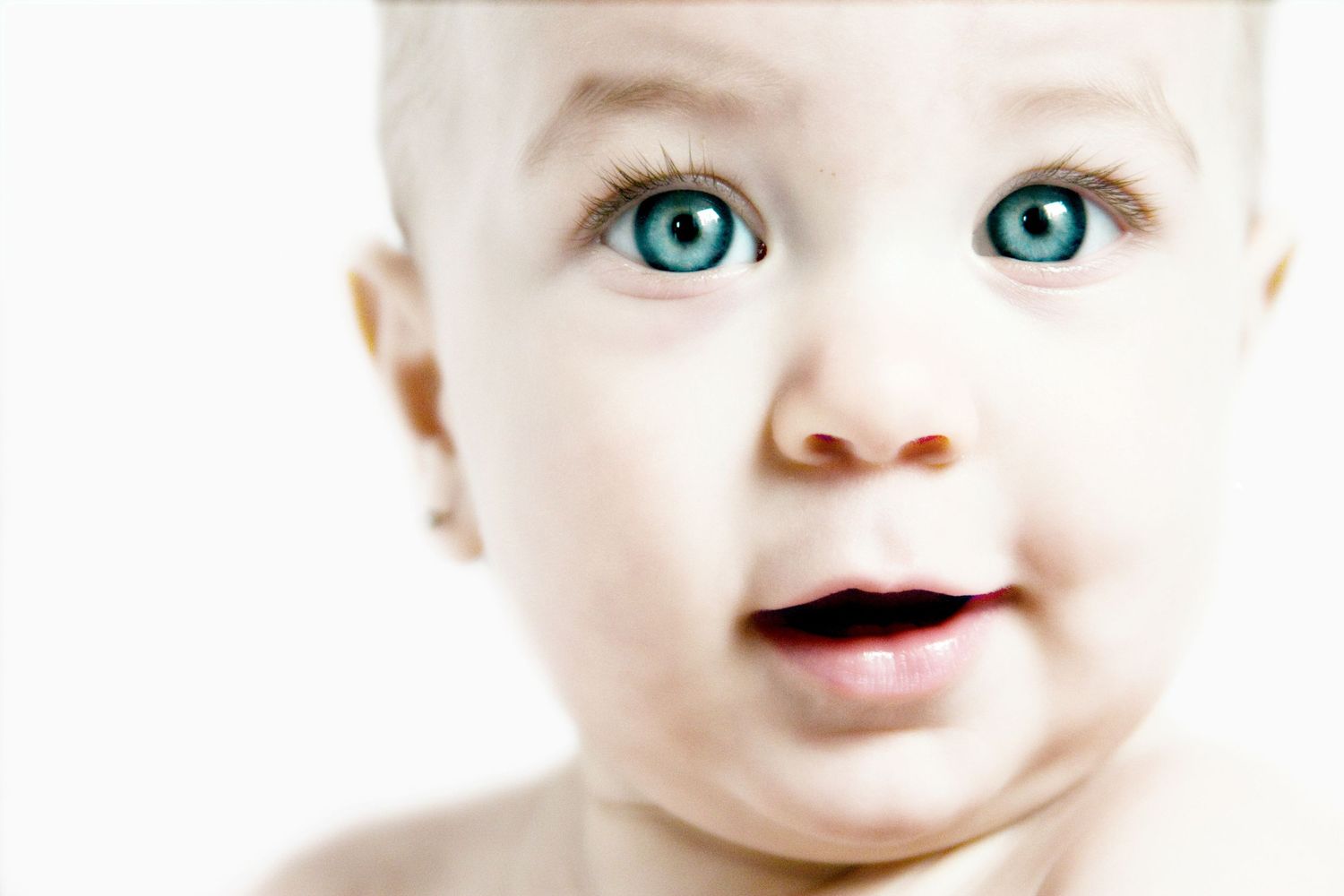 Close-up series highlighting bright blue eyes and innocent expression.