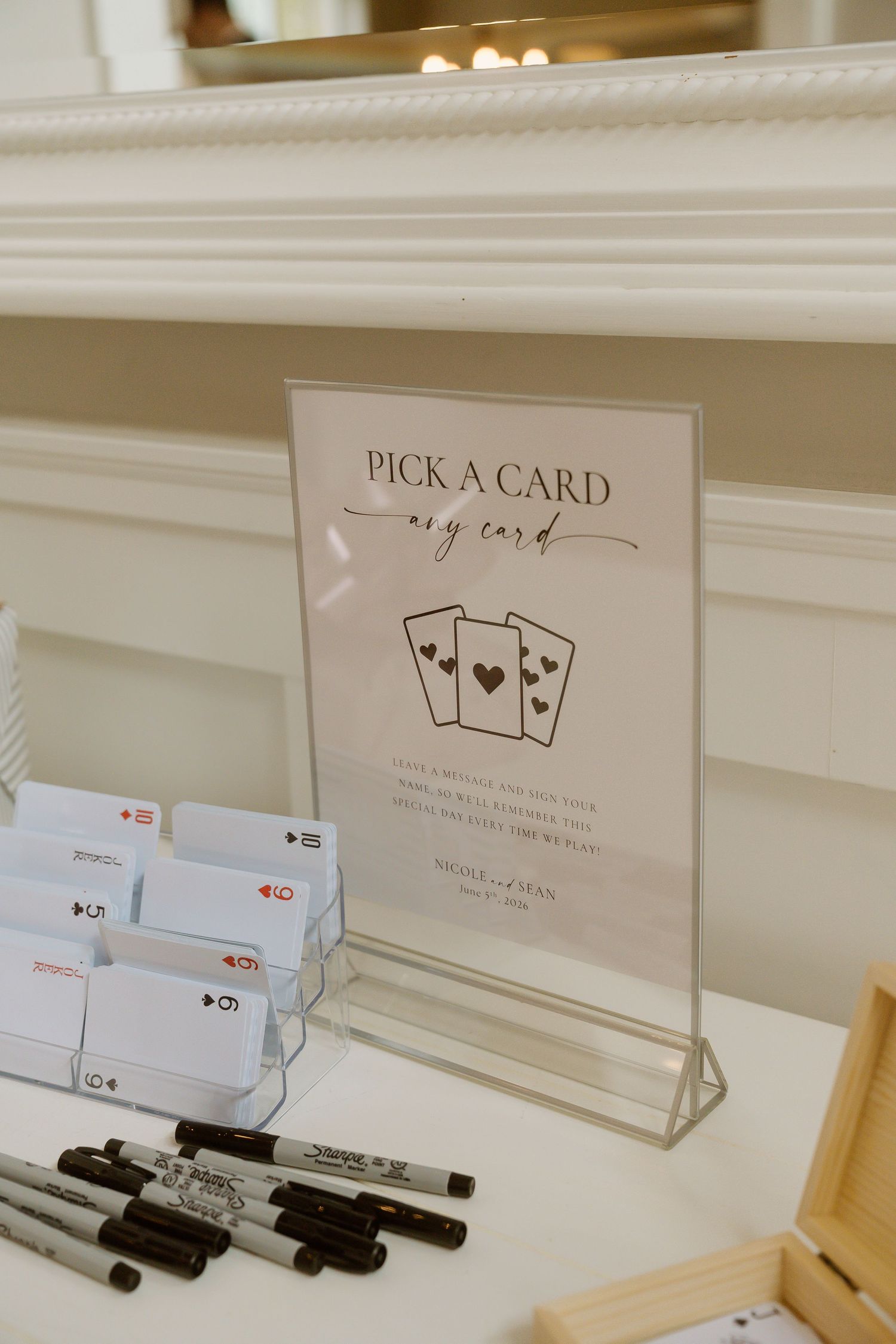 Pick a card wedding guest book alternative display with playing cards and Sharpie markers.