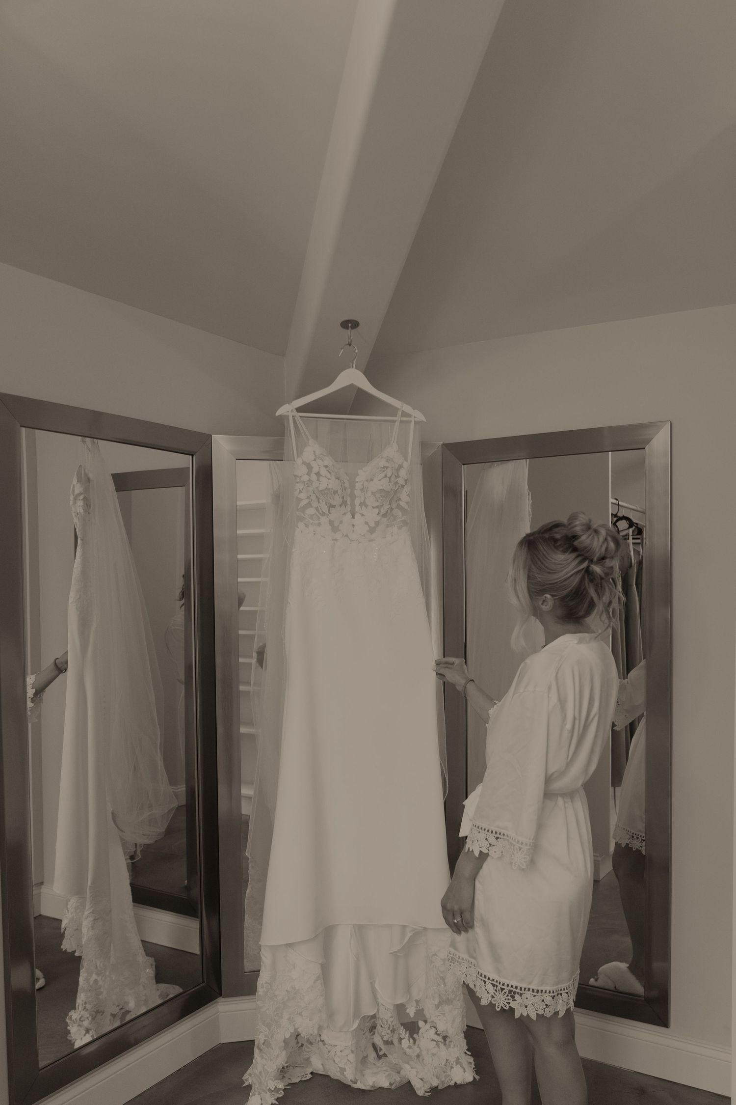 A sequence of vintage-style photographs showing white wedding dresses hanging in a room with mirrors and soft lighting.