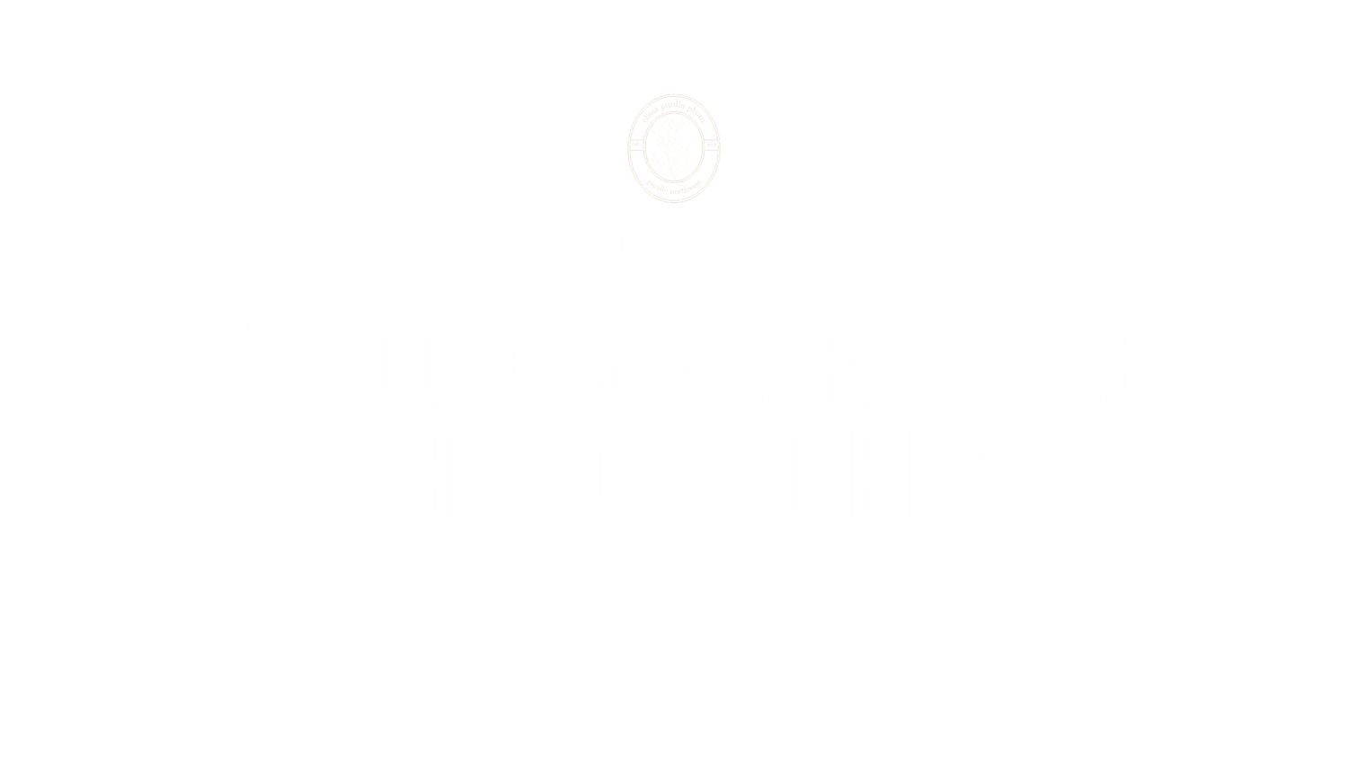 Faint white circular emblem with a subtle inner design centered on a plain white background.