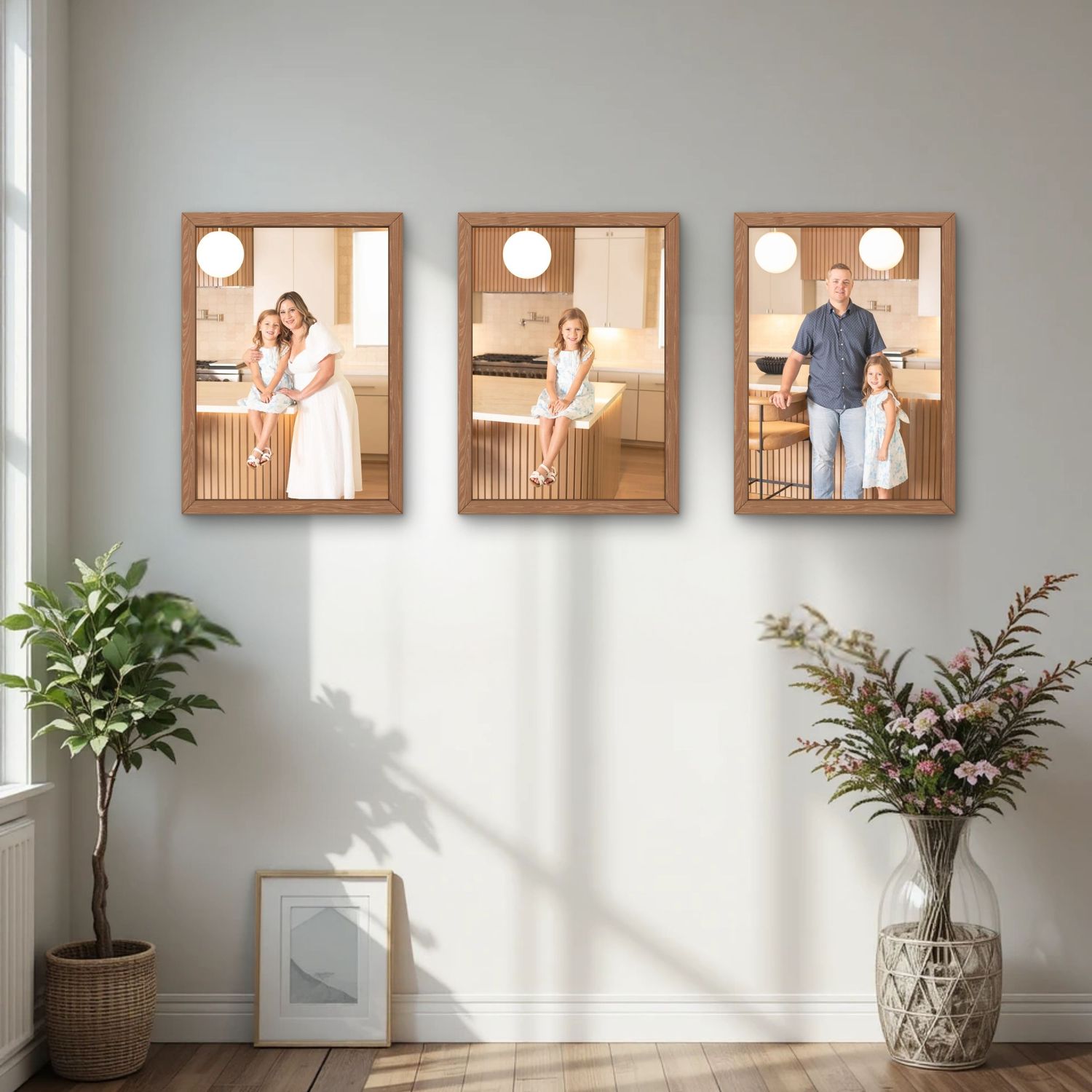 Three wooden framed family photos displayed in a River Oaks home in Houston TX. Showing a family in a inhome portrait as custom wall art.