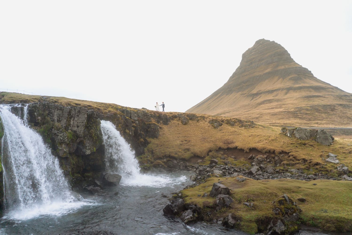 Elopement couple in front of Kirkjufell mountain on Snæfellsnes Peninsula Iceland
