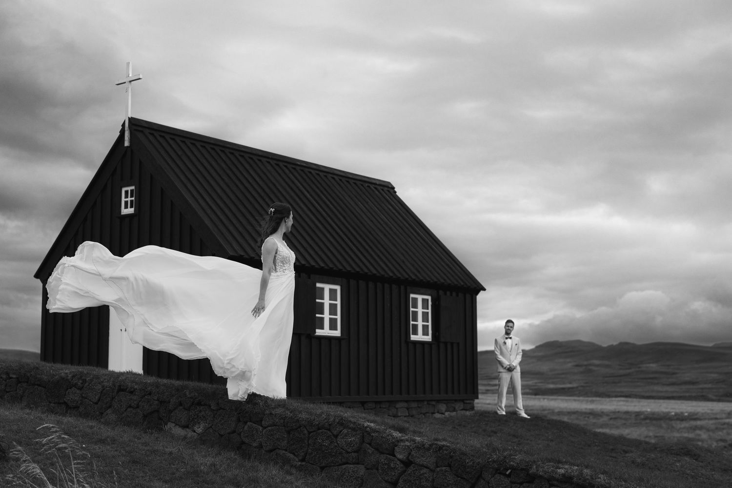 Elopement at Krýsuvíkurkirkja church in Iceland with mountains in the background