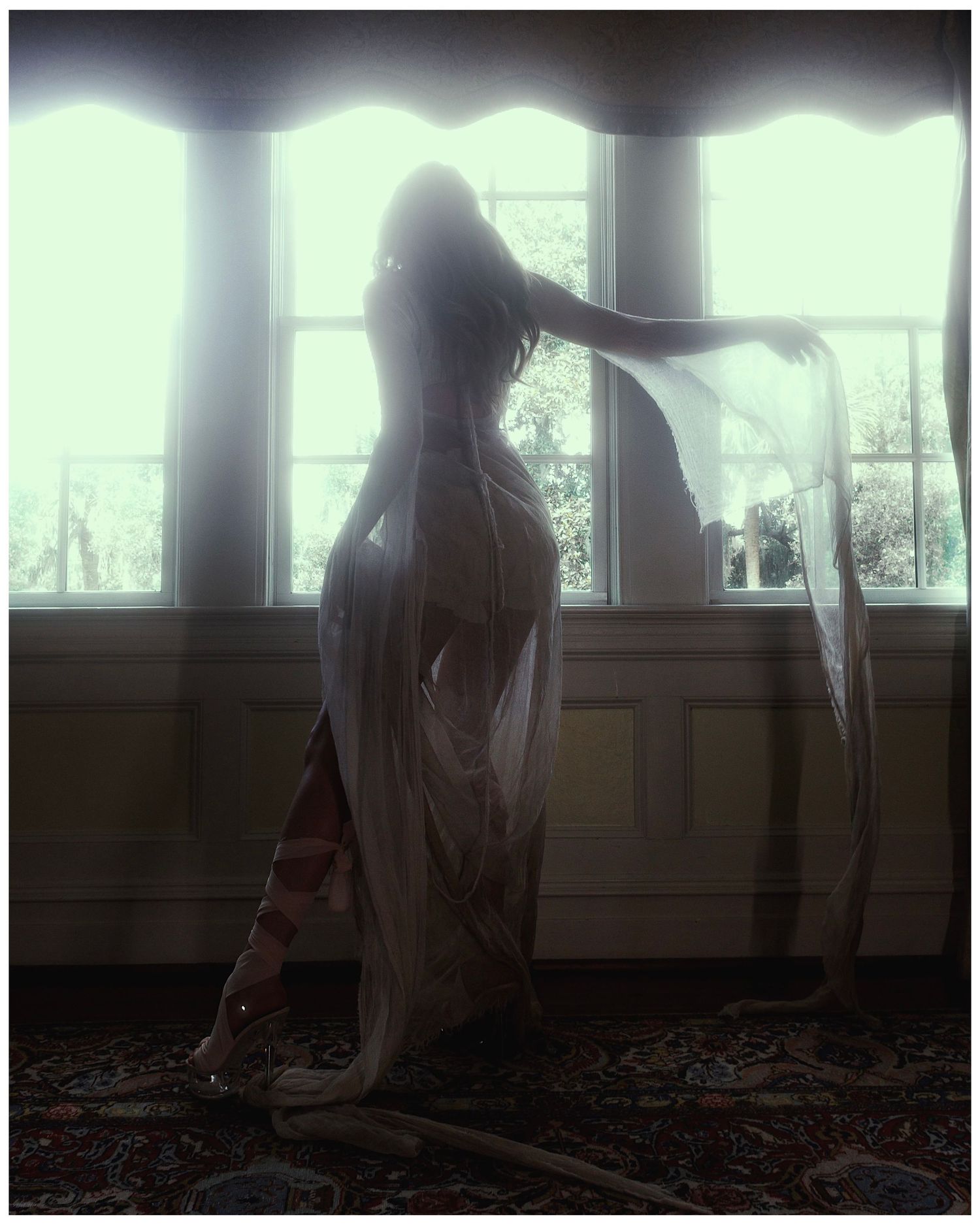 A series of eerie photographs showing a ghostly figure in white moving through a dimly lit interior space.