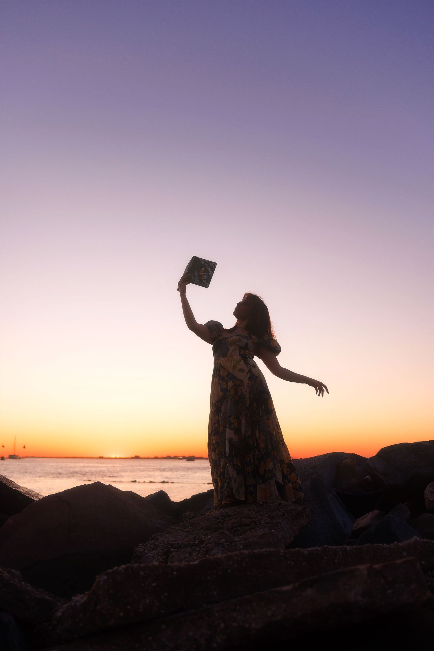 Silhouetted figures dance and pose against a vibrant sunset sky over mountain peaks in a series of connected photos.