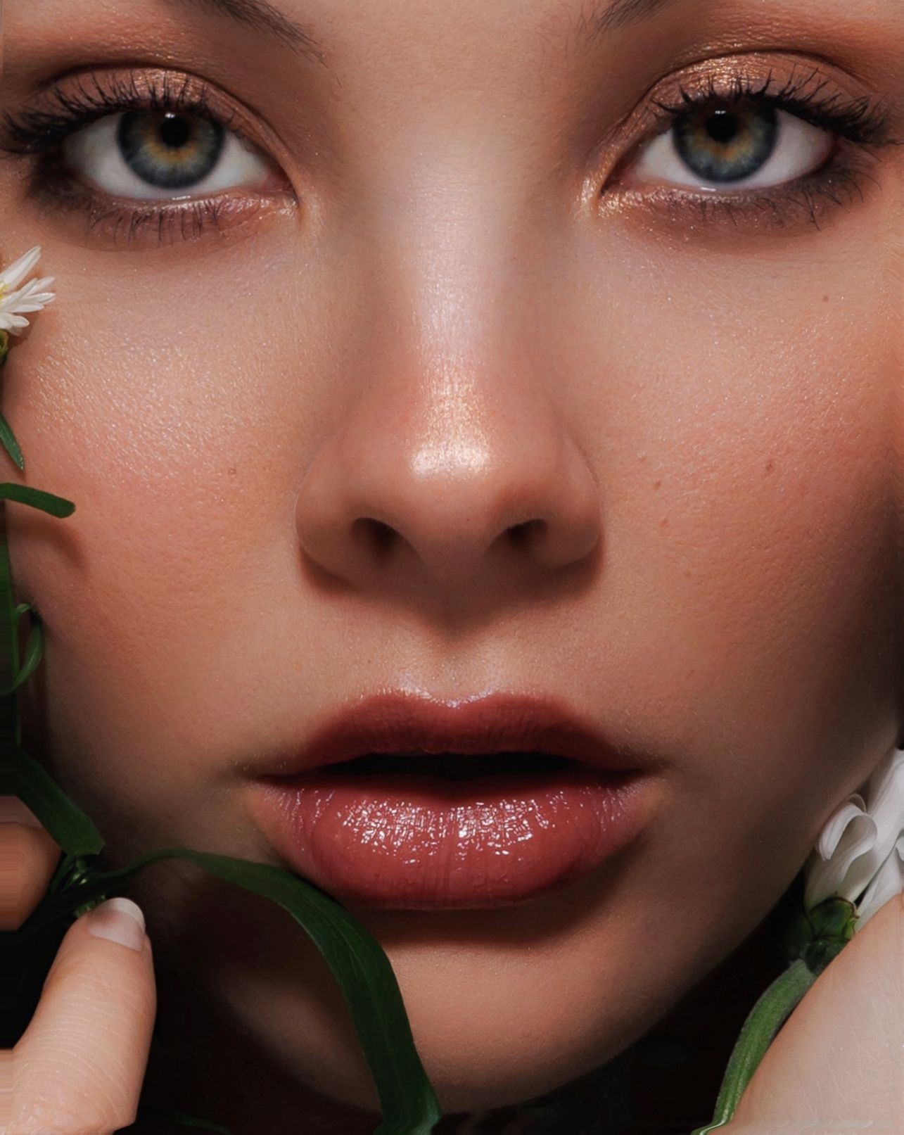 Close-up beauty shot showcasing glossy lips and smoky eye makeup with green foliage accents.