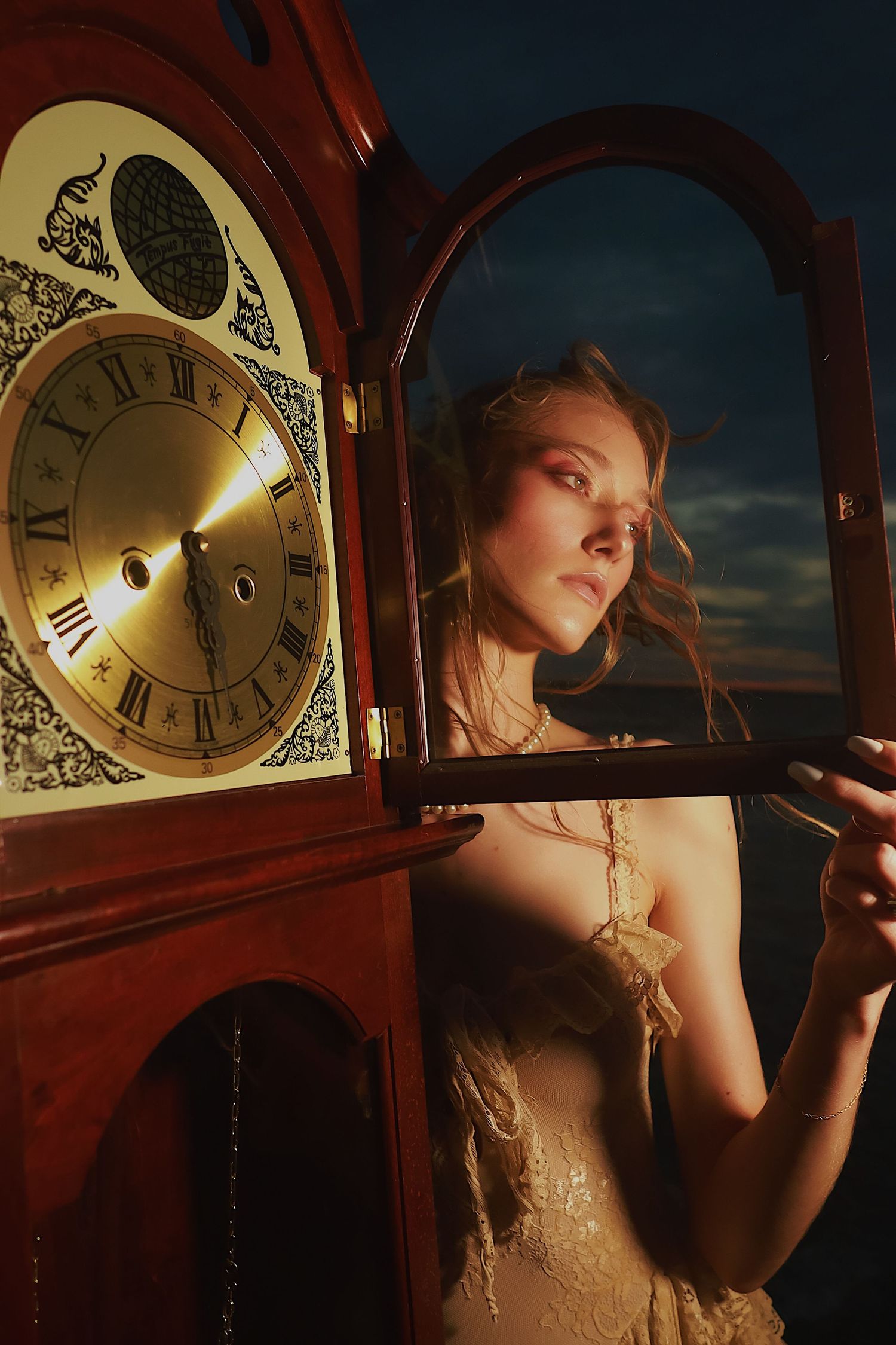 A moody artistic photo series featuring vintage clocks and dramatic lighting against a dark background.