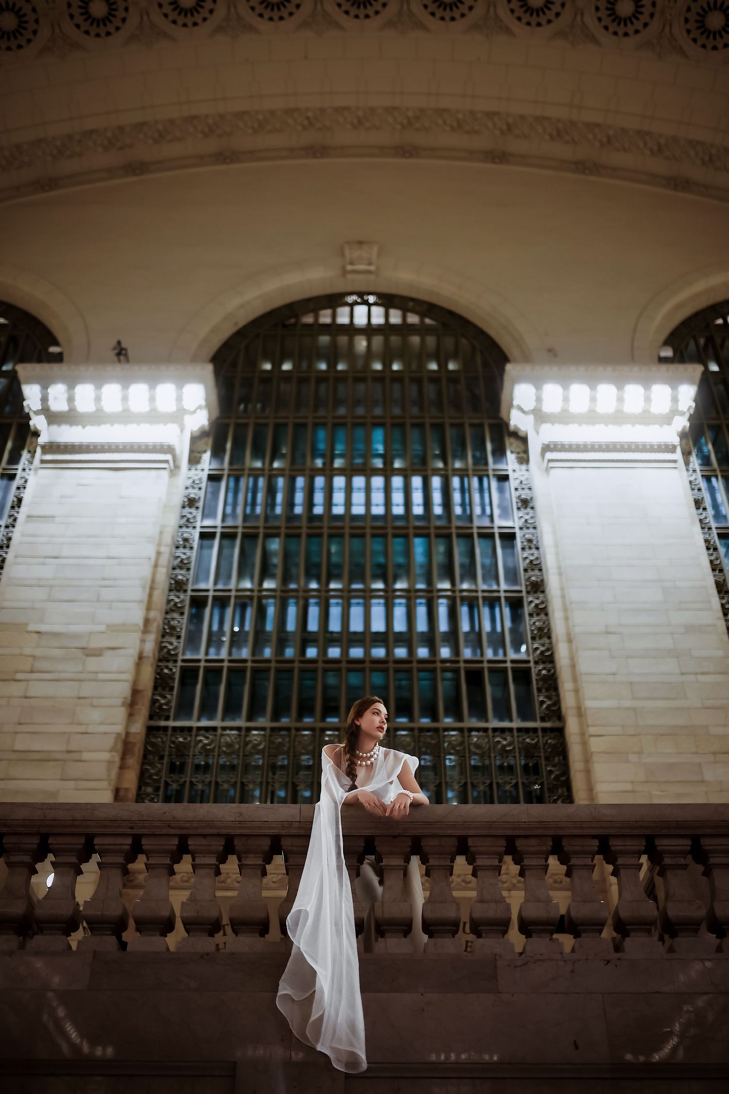 A series of architectural photos showing window arches with ornate metalwork in a historic building interior.