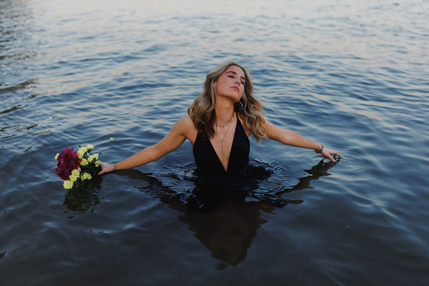 A sequence of photos shows someone swimming and floating in dark blue ocean waters at sunset.