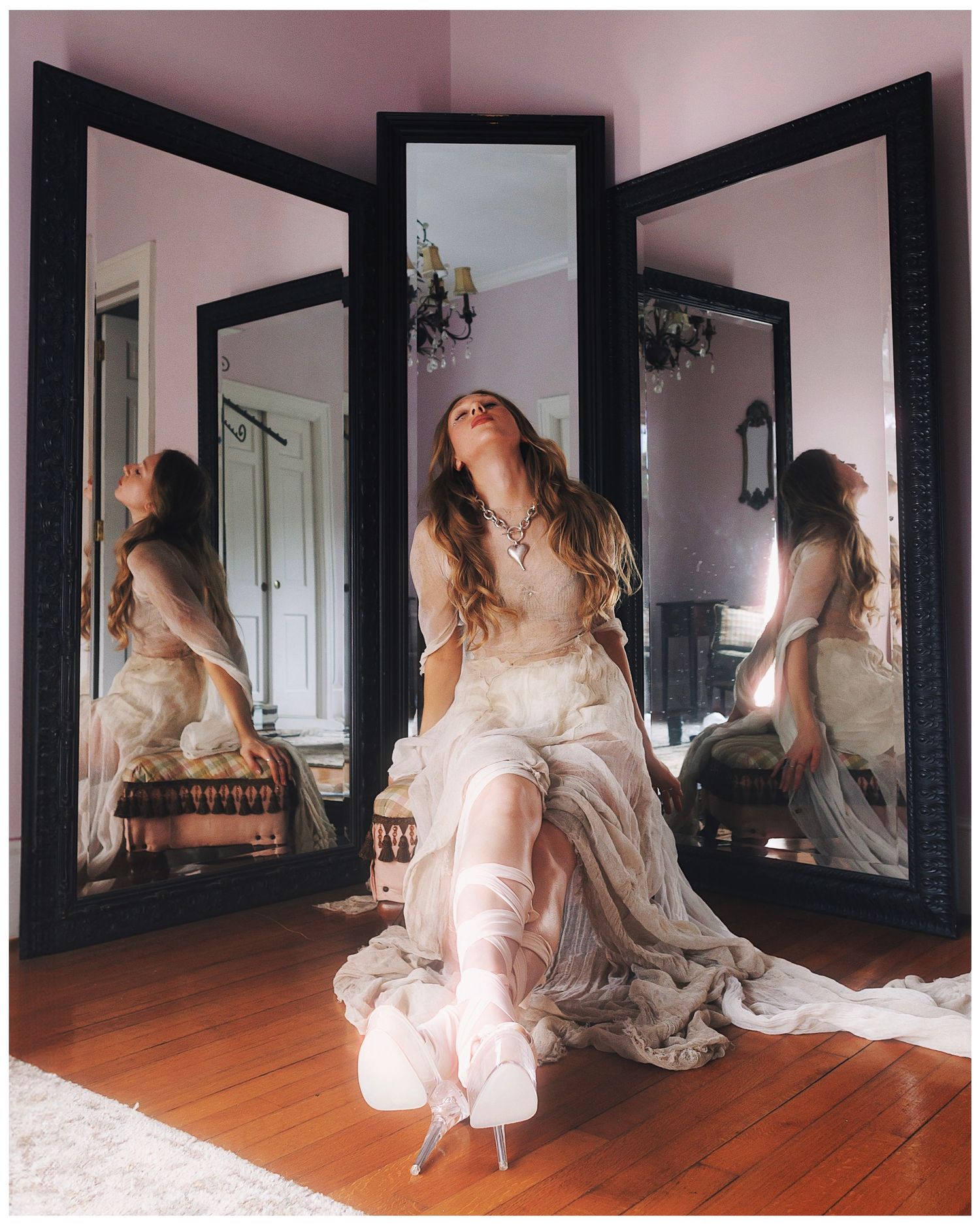 Series of dreamy ethereal photos showing figure in vintage white dress reflected in multiple mirrors in room with wood floors.