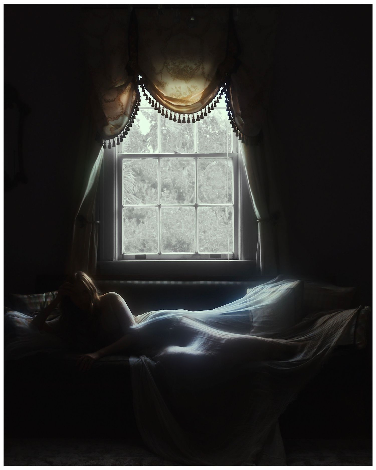 Silhouetted figure seen through frosted window panes in moody atmospheric lighting creates dramatic shadowy composition.