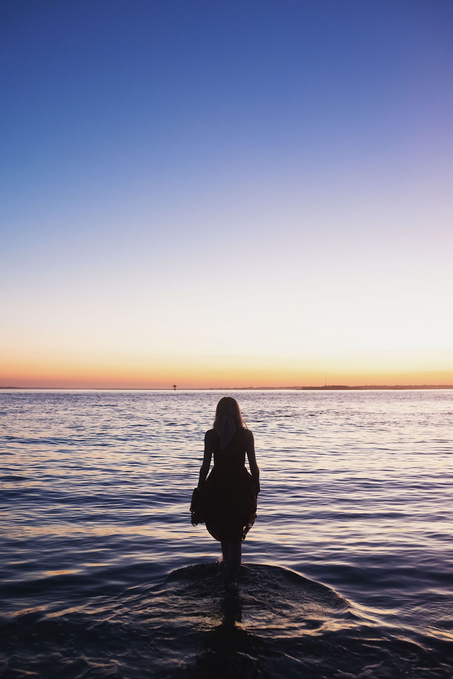 A series of ocean sunset silhouettes showing a person sitting by calm waters during golden hour.