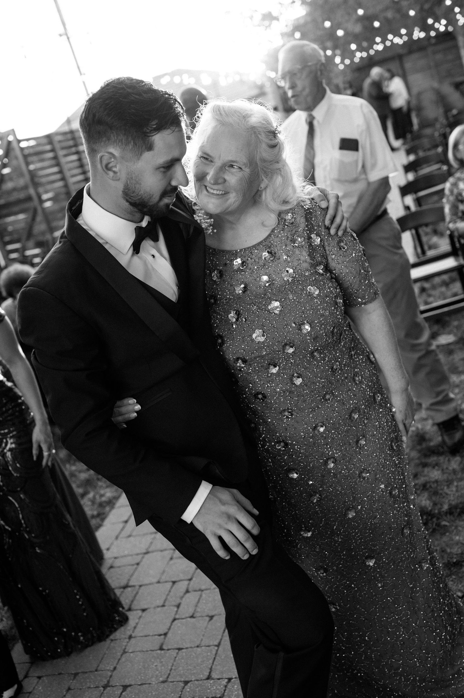 Wedding couple share an intimate moment dancing together as sparklers create a magical glow around them in multiple photos.