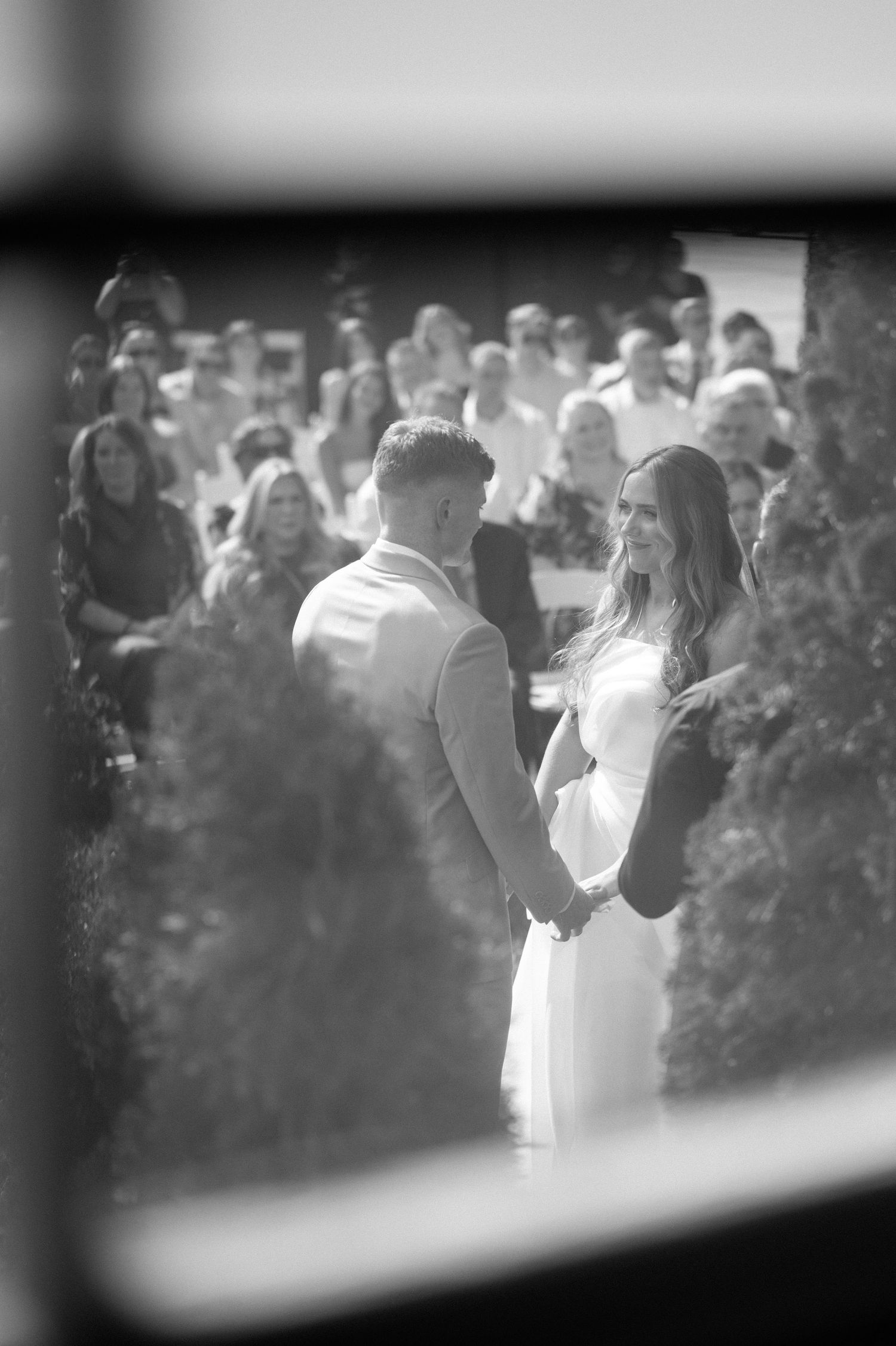 Black and white sequence of wedding photos showing a couple dancing during their first dance at a reception.