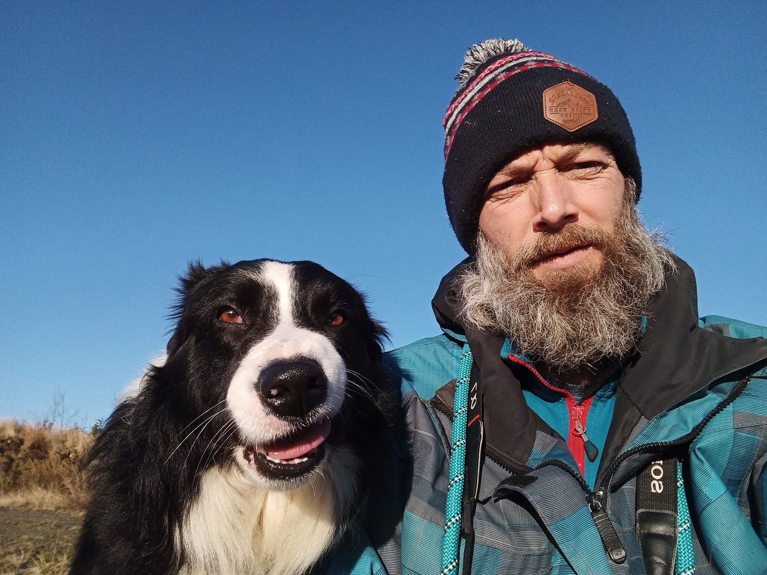 Photo of Mark Gamblin and his dog Scott, who is pulling a funny face