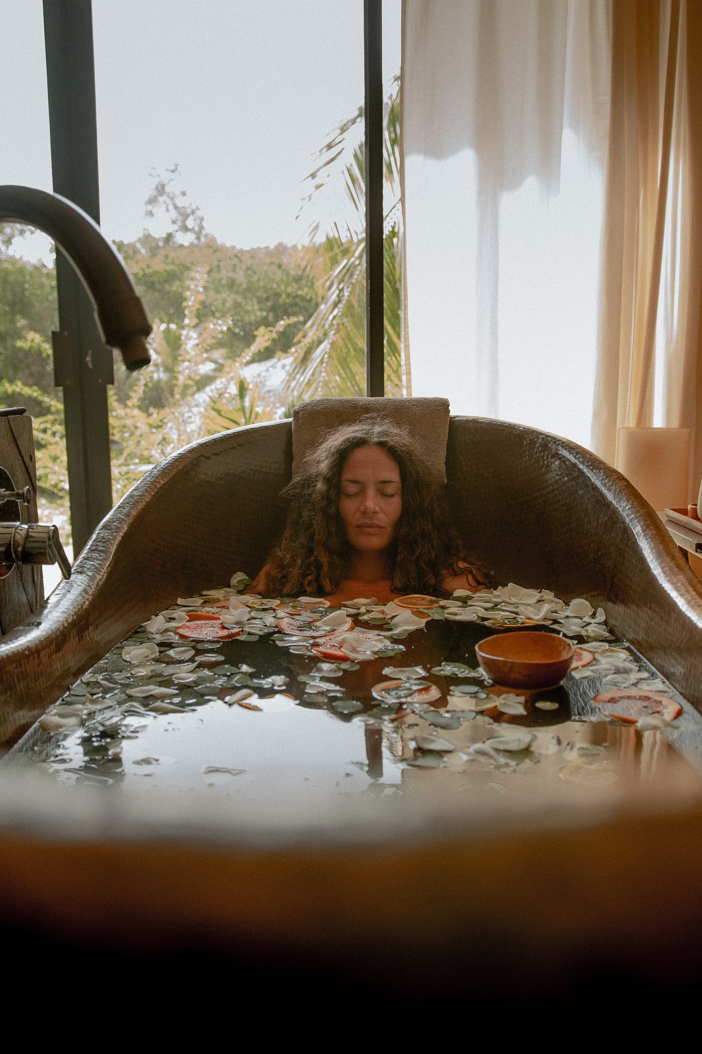 A cozy indoor setting with natural light streaming through windows and scattered puzzle pieces on a table.