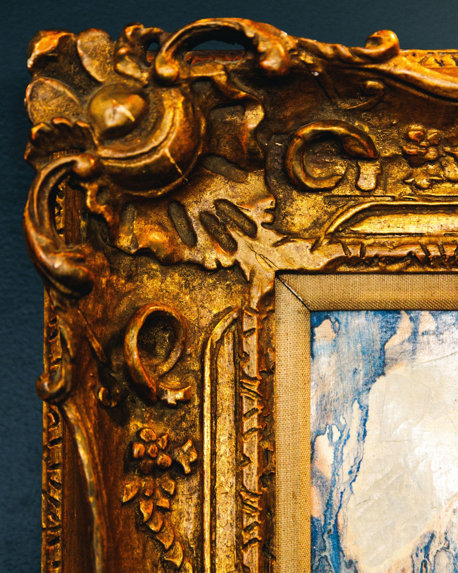 brass corner of an intricate artwork frame