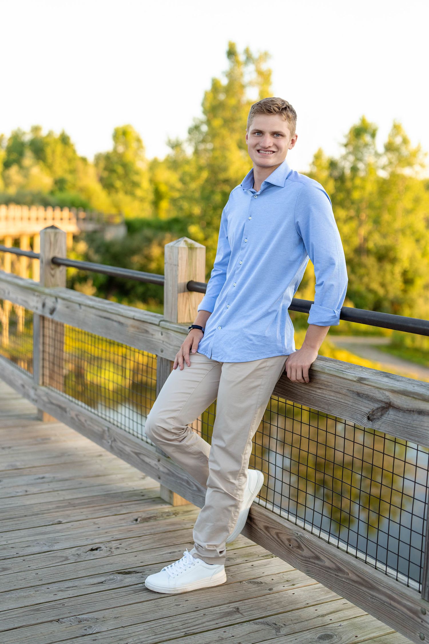 Natural outdoor senior portraits for guys in a Grand Rapids park setting.