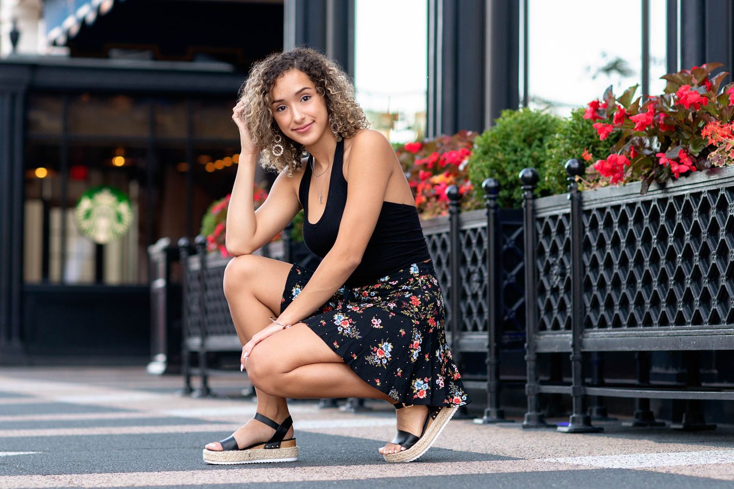 Urban senior pictures for girls featuring downtown Grand Rapids city architecture.