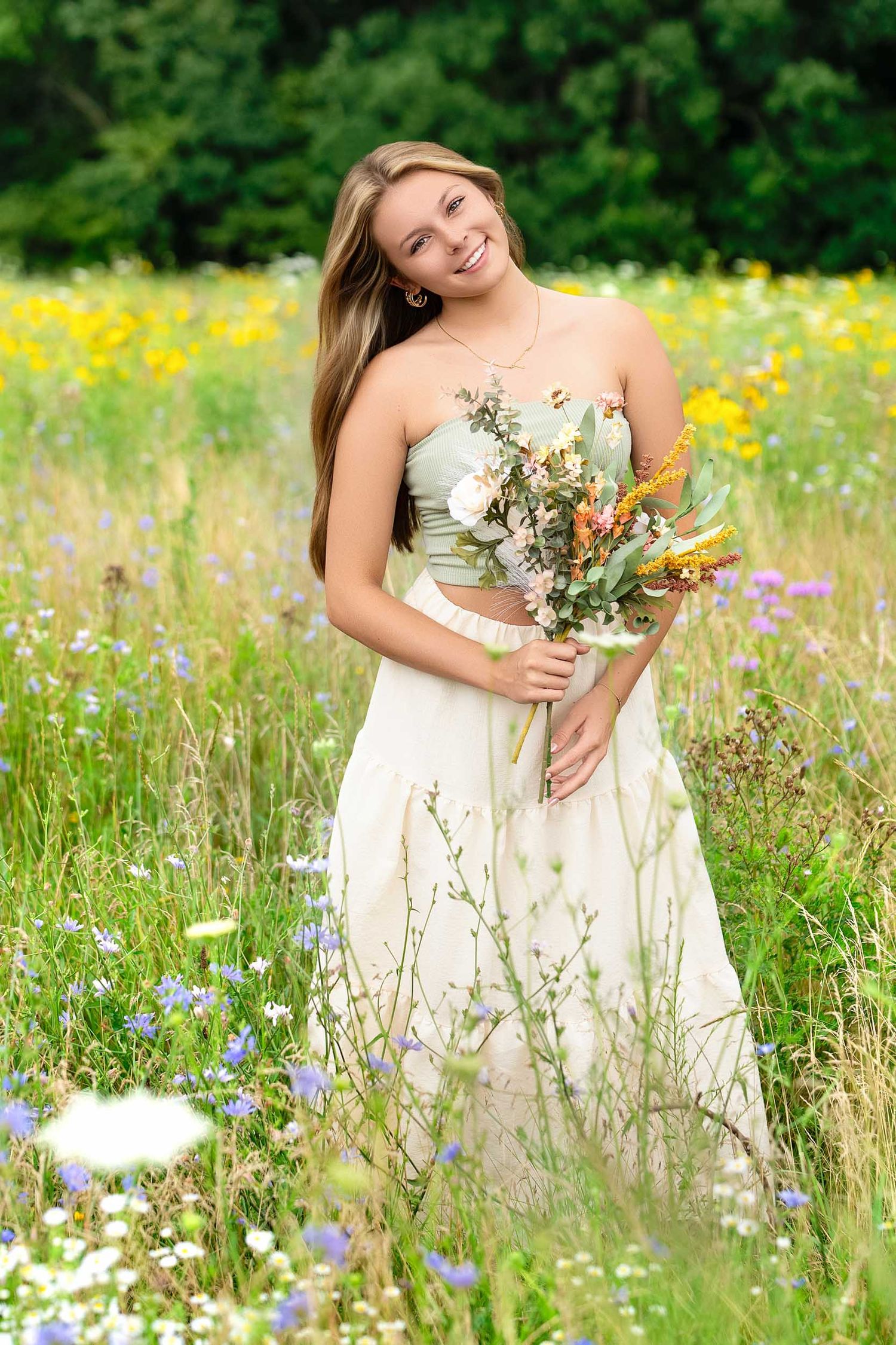 Natural light senior portraits in a West Michigan field with wildflowers.