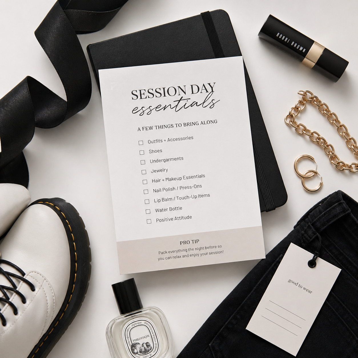 Session day essentials checklist card styled with black notebook, lipstick, gold jewelry, shoes, and perfume flatlay.