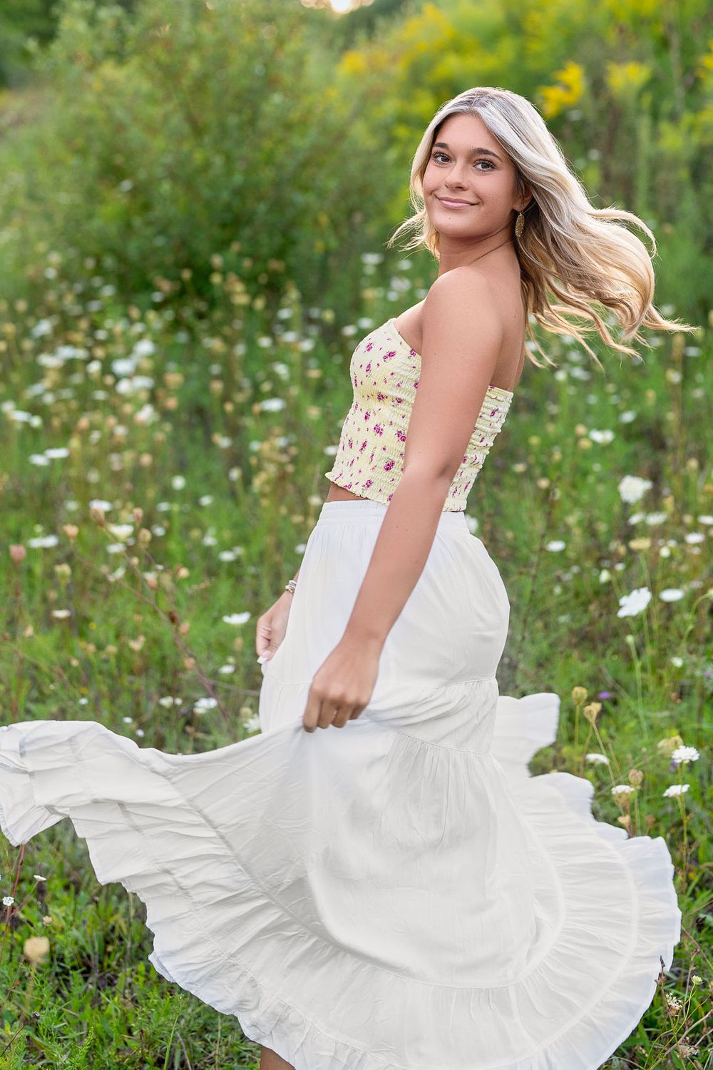 Grand Rapids senior portrait wildflower field golden hour Carmen Marie Photography