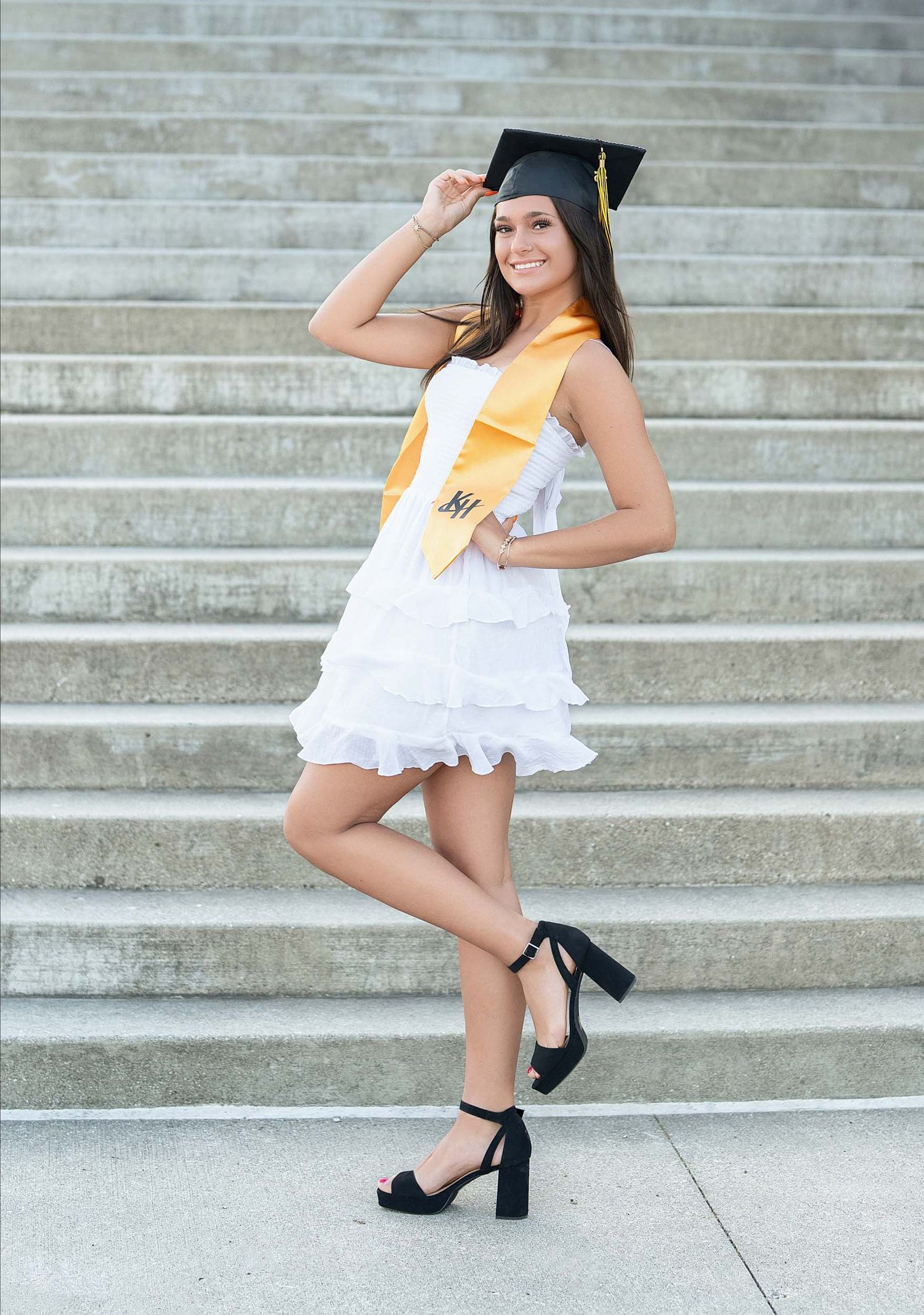 Grand Rapids senior photographer can and gown portrait session