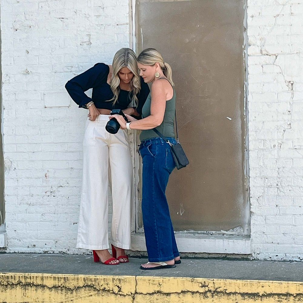 Carmen Marie Photography Grand Rapids senior photographer reviewing photos with senior on camera