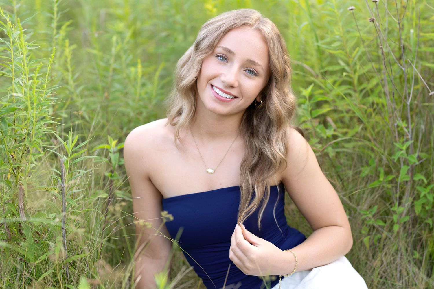 Modern and polished senior portraits for a high school senior in a West Michigan park setting.