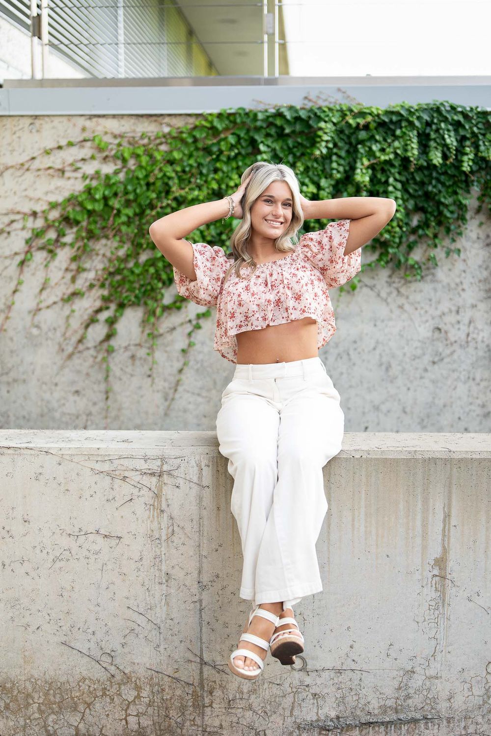 Grand Rapids senior portraits pink outfit white wall