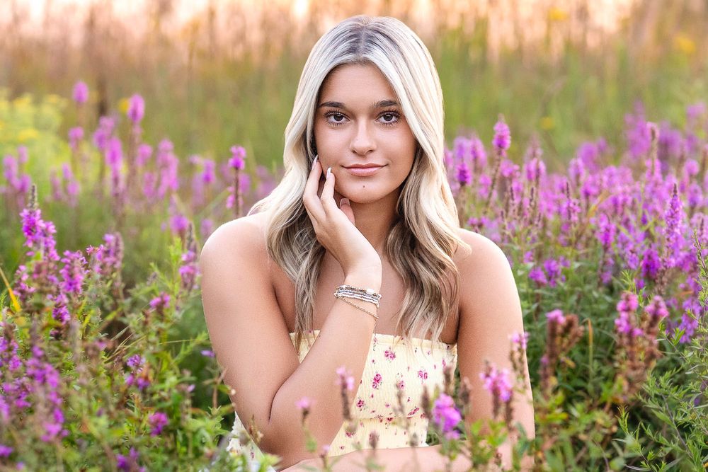 Grand Rapids senior portrait in purple wildflower field Carmen Marie Photography
