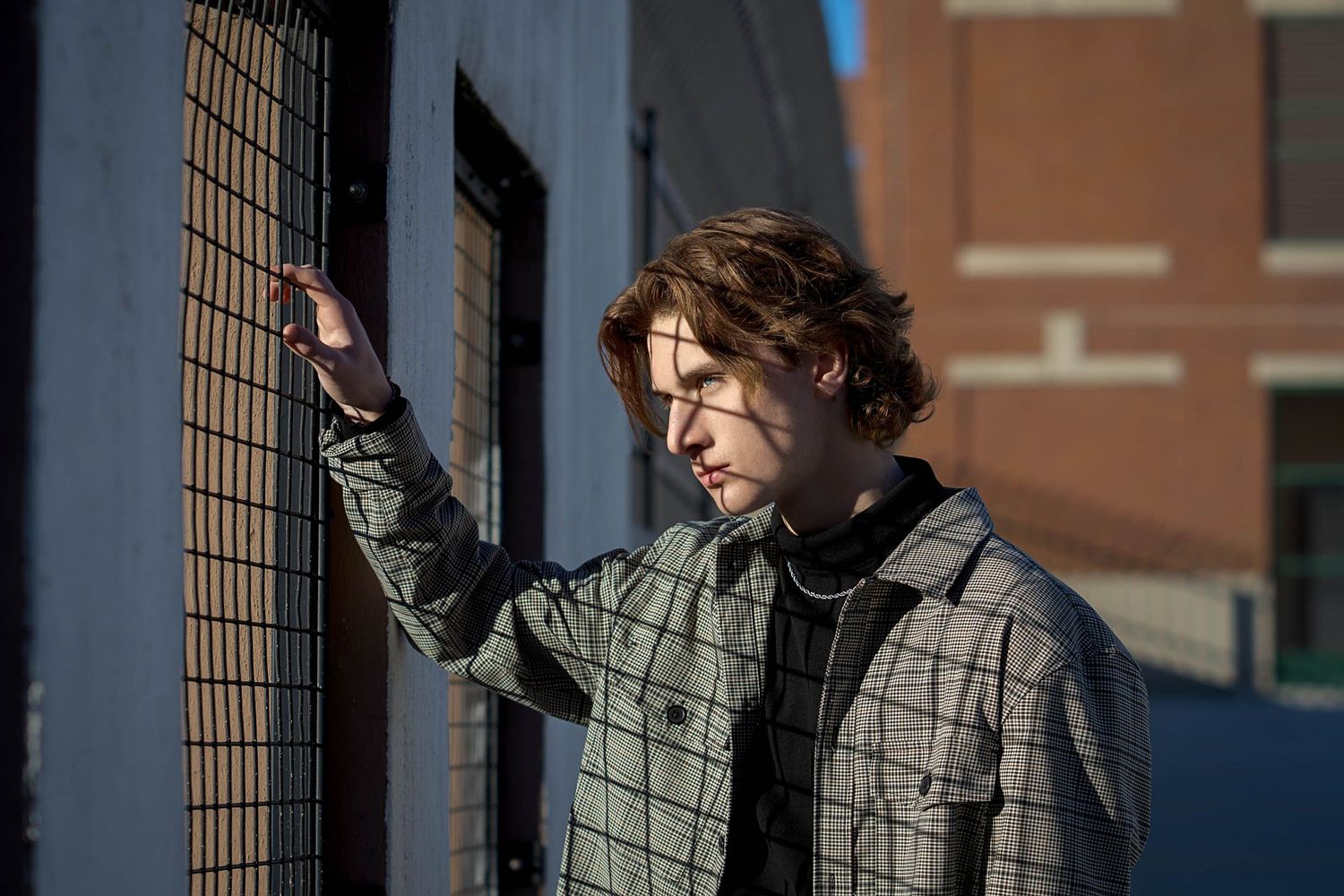 Artistic and edgy senior portrait for guys in an urban Grand Rapids location.
