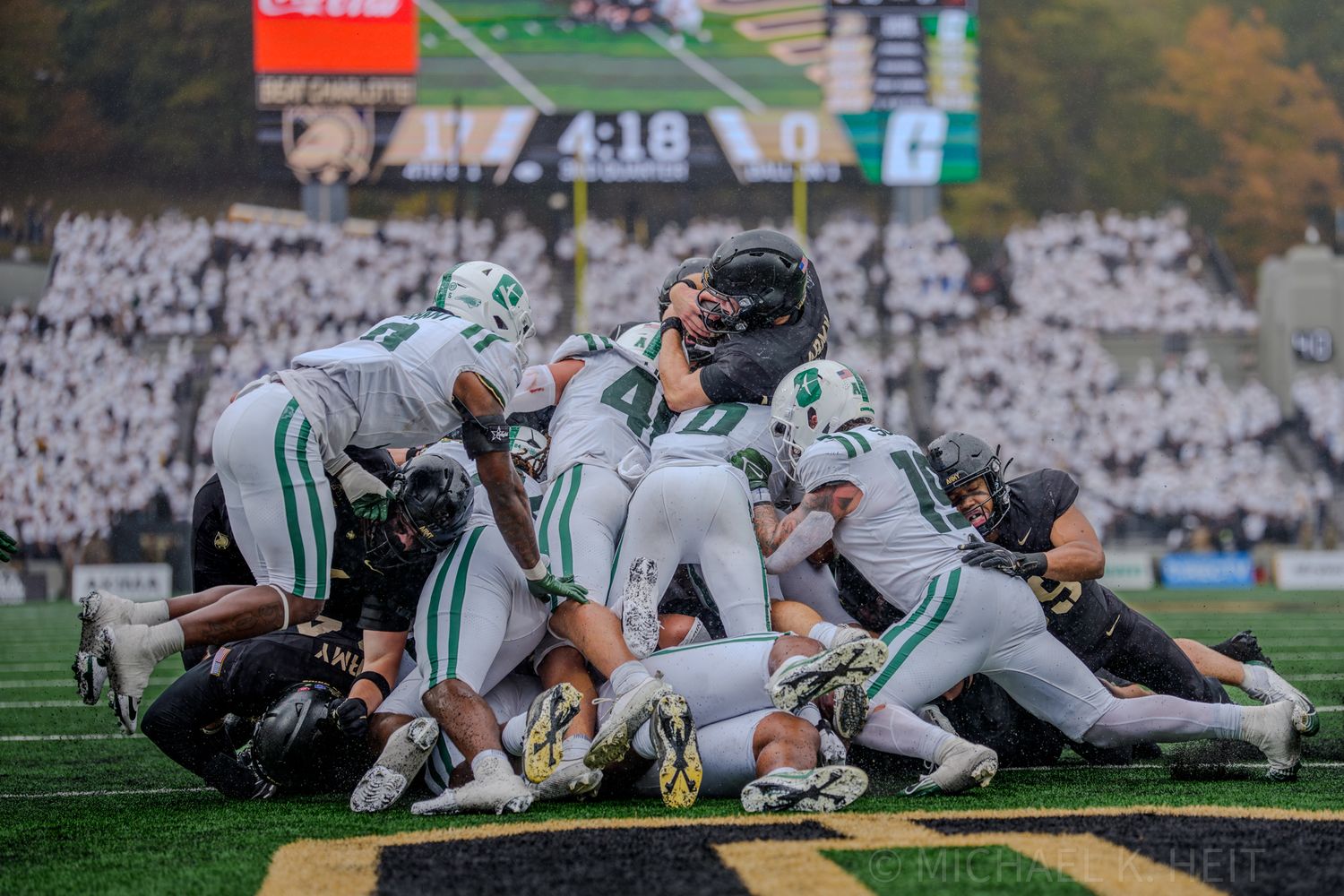 Players pile up during a goal-line play between Army and Tulane.
